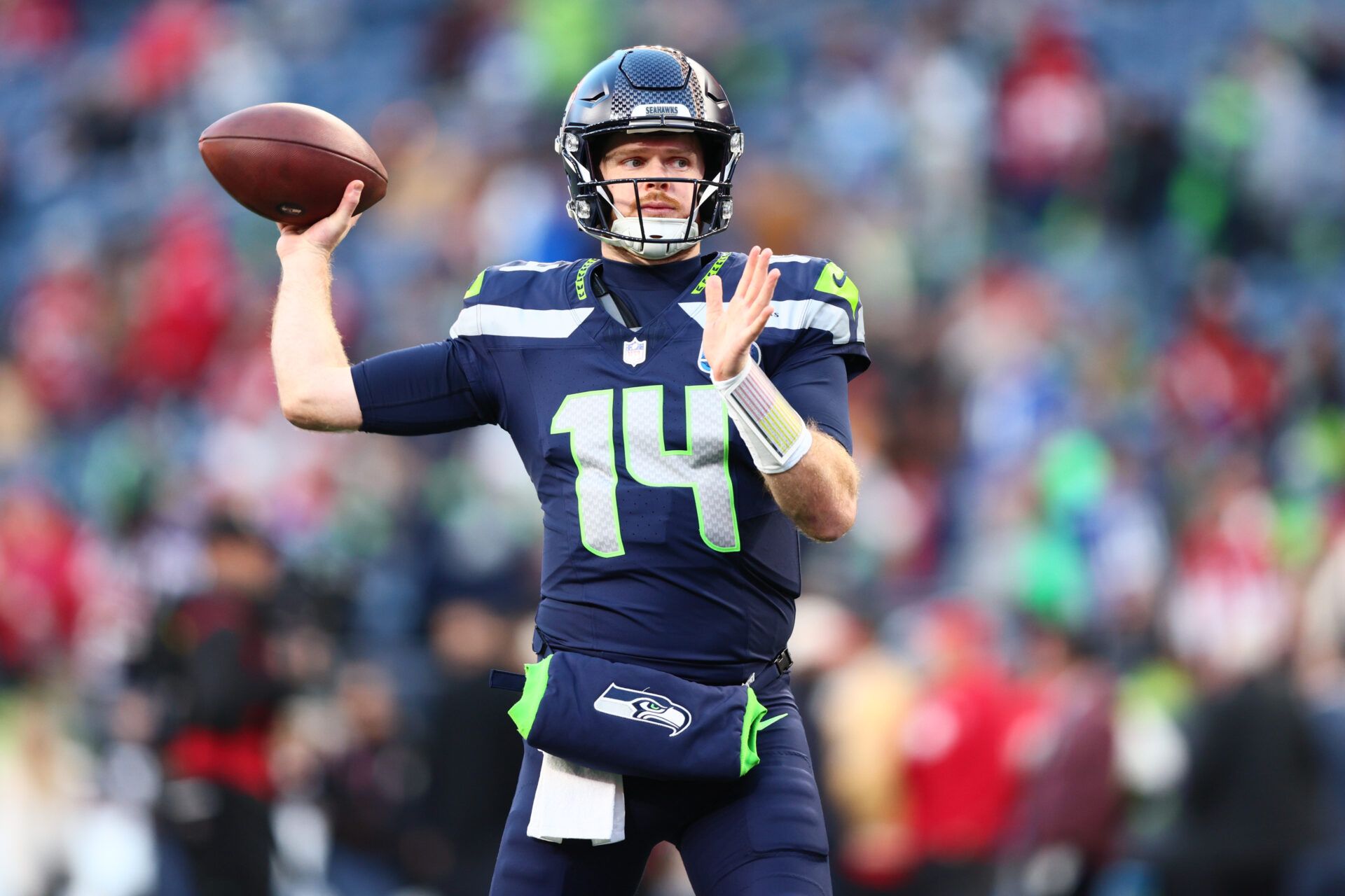 Seattle Seahawks quarterback Sam Darnold (14) warms up prior to a game against the San Francisco 49ers in an NFC Divisional Round game at Lumen Field.