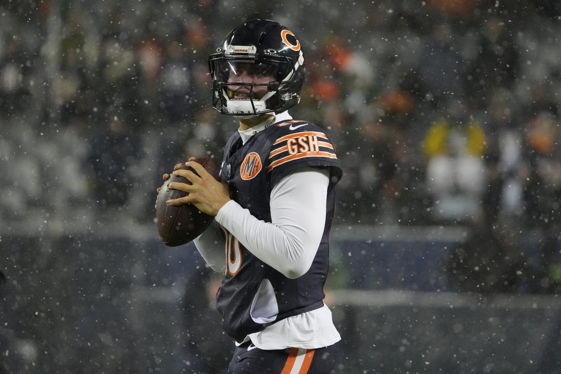 Chicago Bears quarterback Caleb Williams (18) warms up prior to an NFC Wild Card Round game against the Green Bay Packers at Soldier Field.