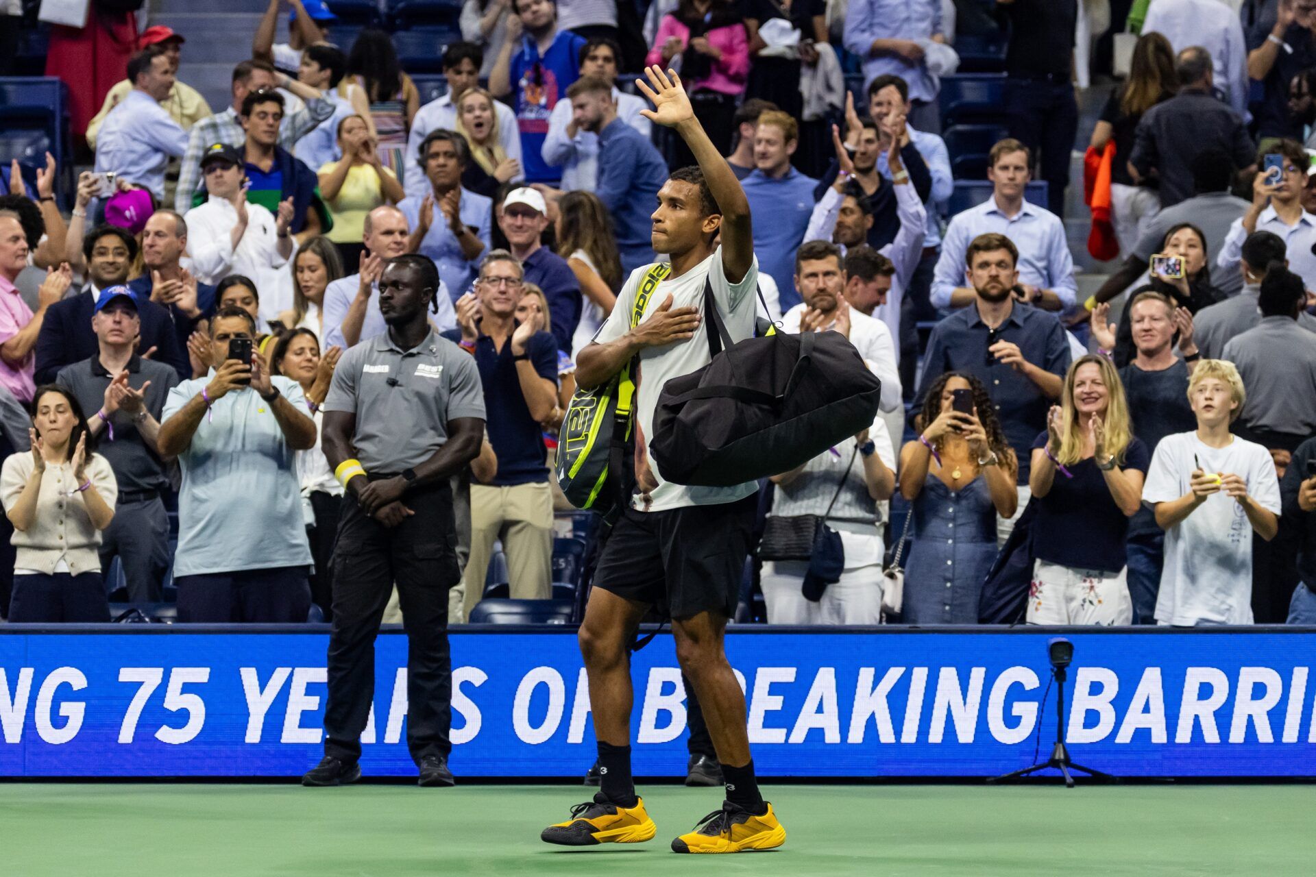 Felix Auger-Aliassime of Canada acknowledges the audience after his match against Jannik Sinner of Italy in the semifinal of the men’s singles at the US Open at Arthur Ashe Stadium in Billie Jean King National Tennis Center.