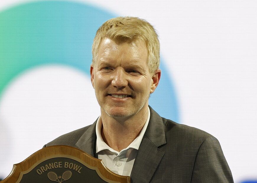 Tennis Hall of Fame member Jim Courier holds a plaque after being inducted in to the Orange Bowl Tennis Hall of Fame prior to the match between Alexander Zverev (GER) and Casper Ruud (NED(both not pictured) in a men's singles quarterfinal match in the Miami Open at Hard Rock Stadium.