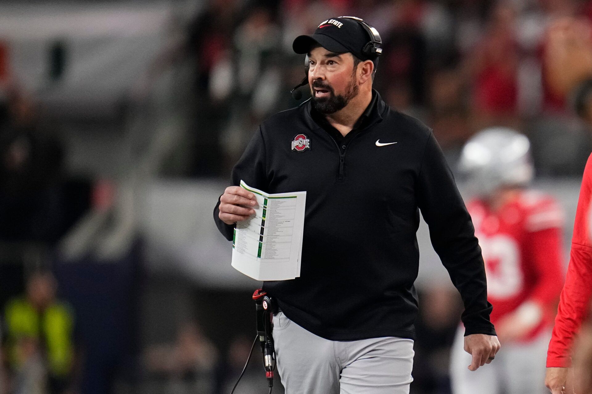 Ohio State Buckeyes head coach Ryan Day watches from the sideline during the Cotton Bowl at AT&T Stadium in Arlington, Texas for the College Football Playoff quarterfinal game against the Miami Hurricanes on Dec. 31, 2025.