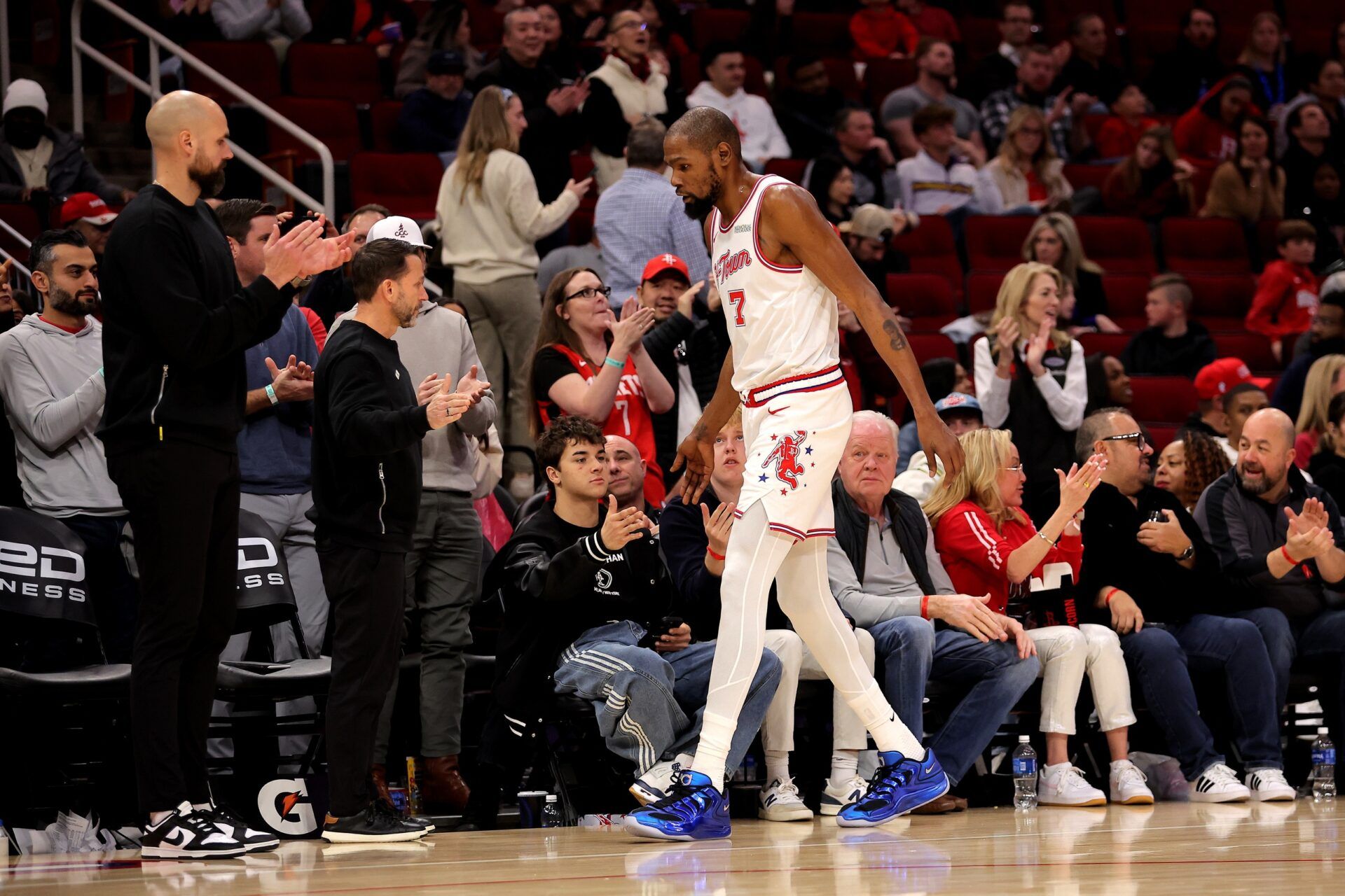 Houston Rockets forward Kevin Durant (7) shakes hands with fans courtside after leaving the game against the New Orleans Pelicans during the fourth quarter at Toyota Center.