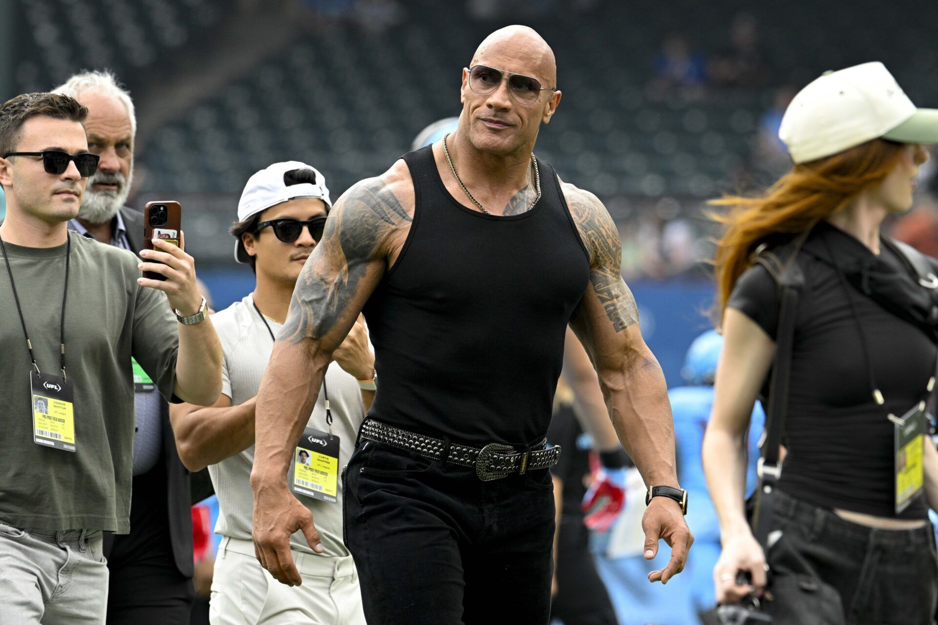 UFL owner Dwayne Johnson aka The Rock walks off the field before the game between the Arlington Renegades and the Birmingham Stallions at Choctaw Stadium.
