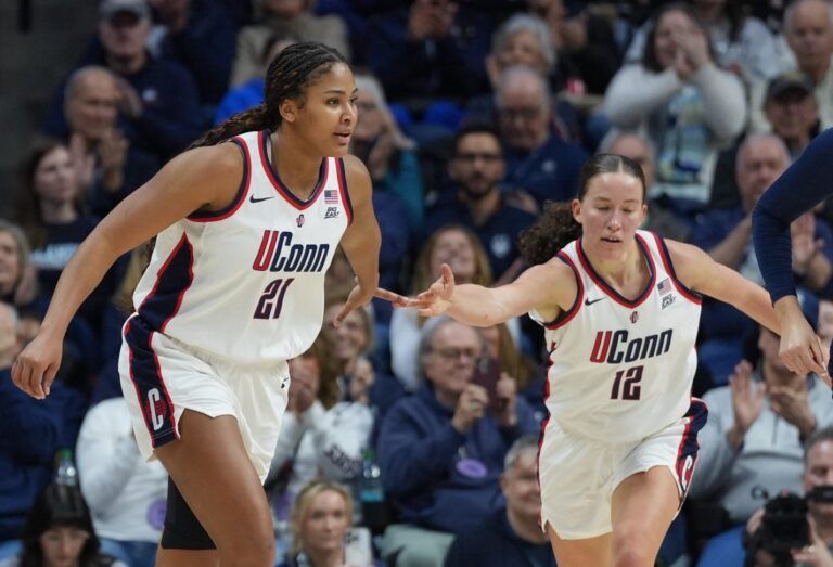 UConn Huskies forward Sarah Strong (21) and guard Ashlynn Shade (12) react after a play against the Villanova Wildcats in the second half at Harry A. Gampel Pavilion.
