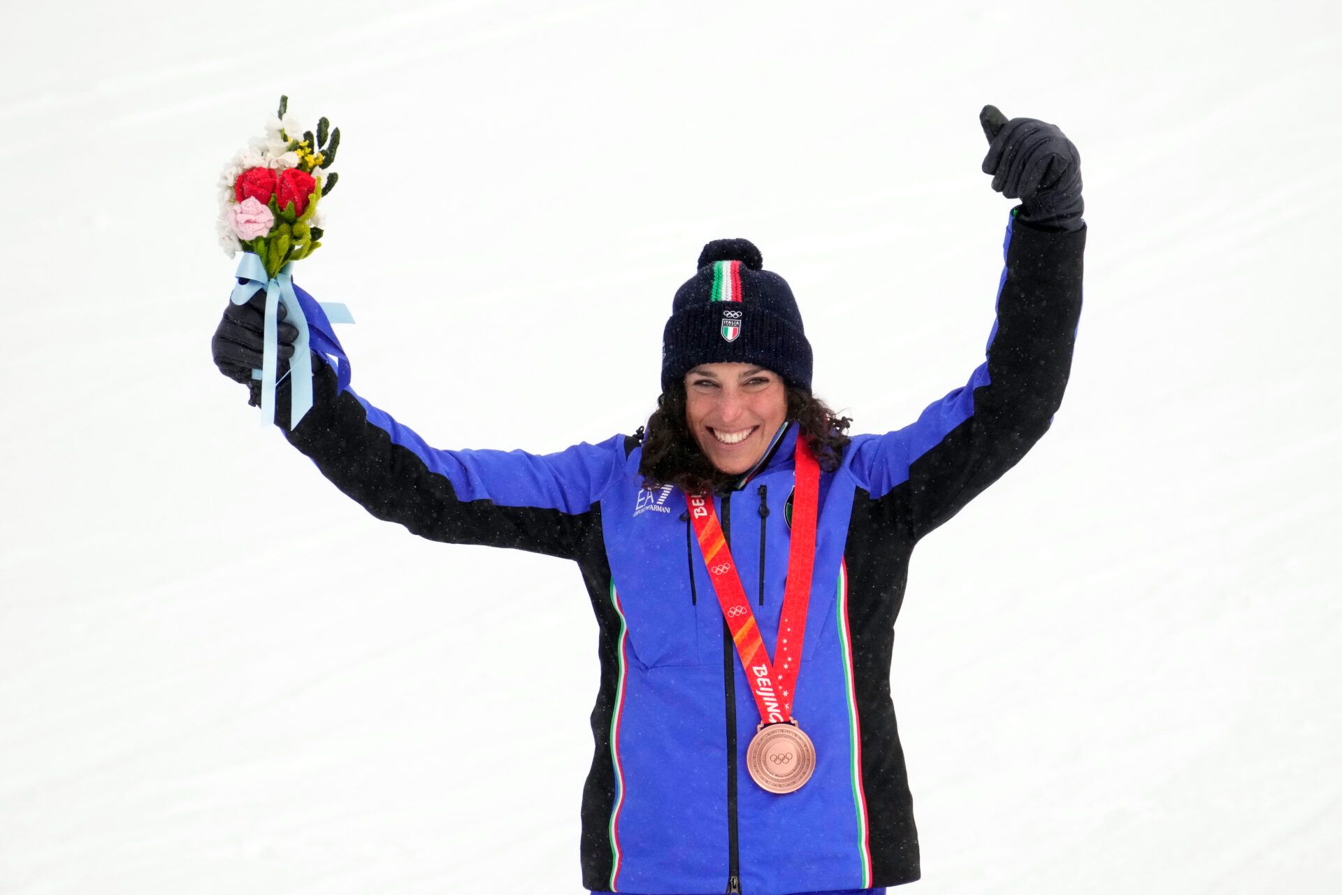 Frederica Brignone (ITA) celebrates after winning the bronze medal in the women’s alpine skiing combined event during the Beijing 2022 Olympic Winter Games at Yanqing Alpine Skiing Centre.