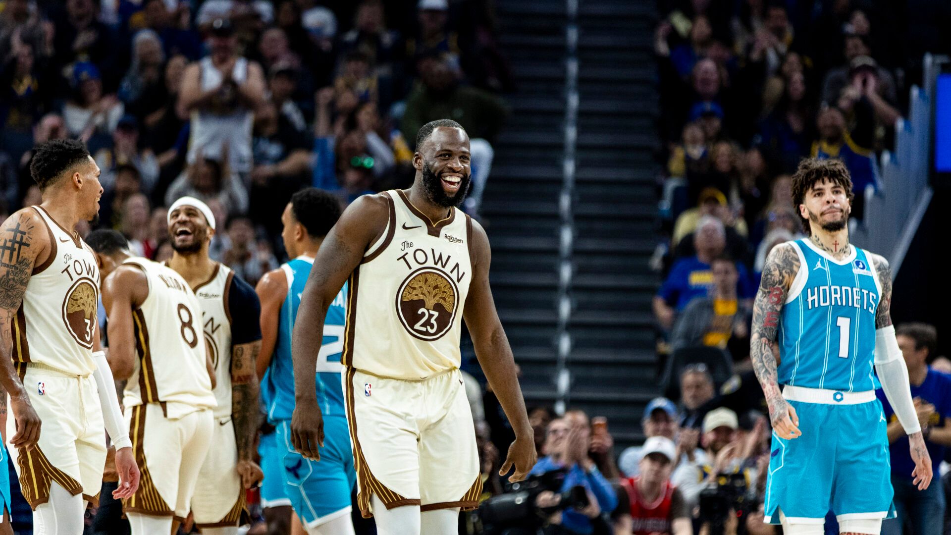 Golden State Warriors forward Draymond Green (23) reacts after a teammate scored against the Charlotte Hornets during the third quarter at Chase Center.