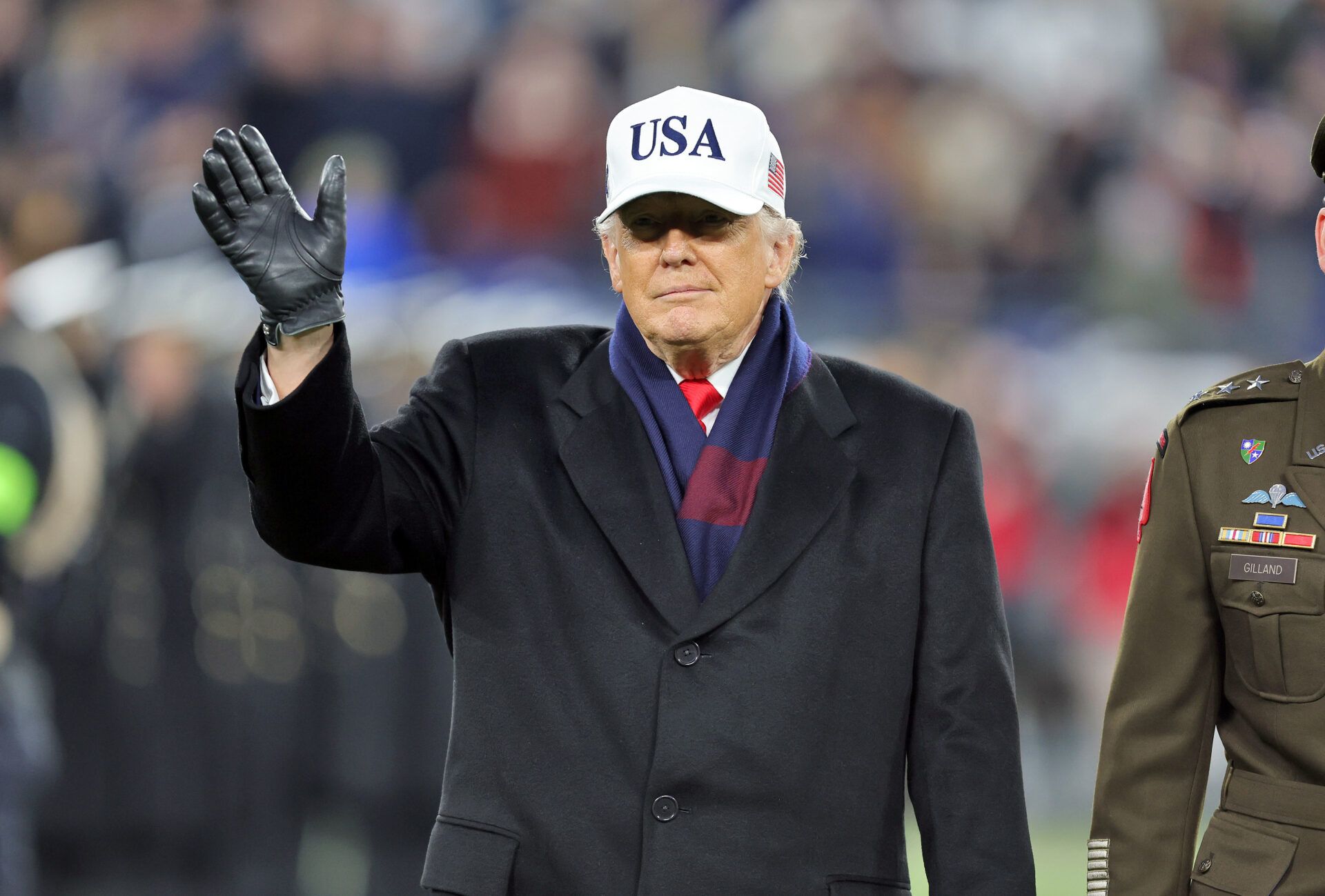 President Donald J. Trump waves during the first half of the 126th Army-Navy game at M&T Bank Stadium.