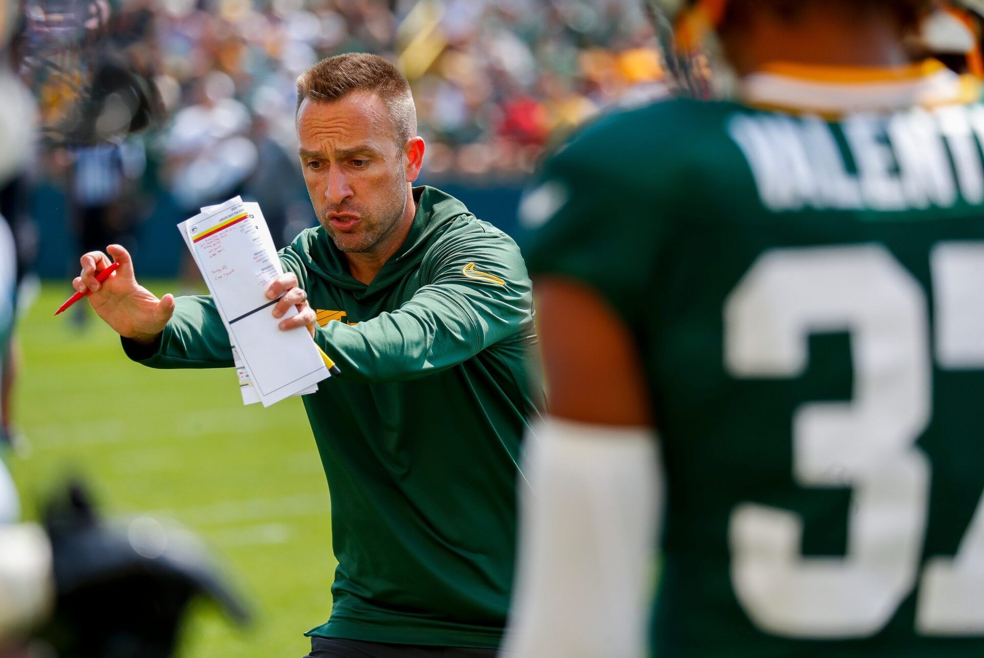 Green Bay Packers defensive coordinator Jeff Hafley gives instruction during a drill with defensive backs on Saturday, July 27, 2024, at Ray Nitschke Field in Ashwaubenon, Wis.