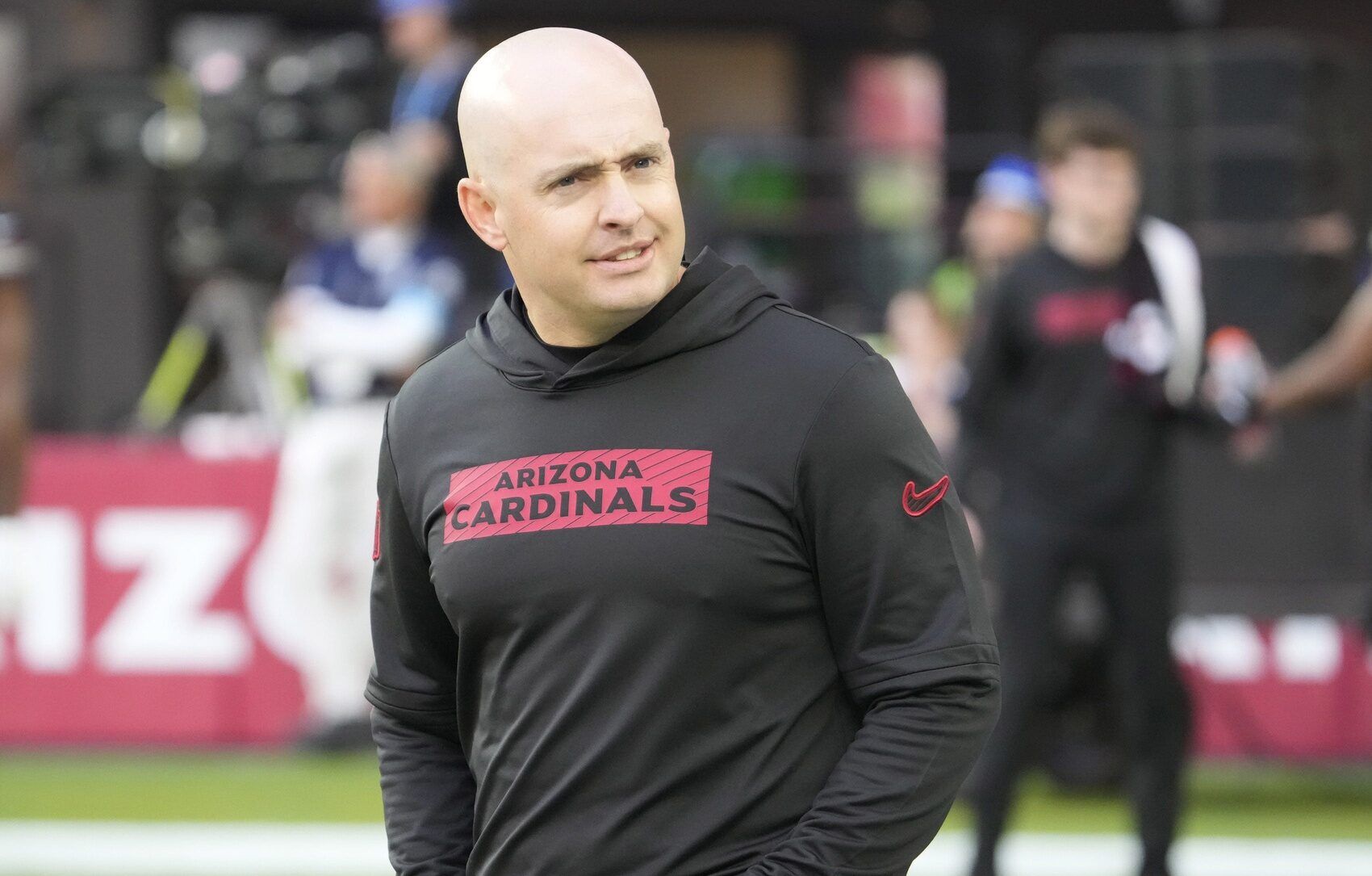 Arizona Cardinals offensive coordinator Drew Petzing watches his players warm up before playing against the Seattle Seahawks at State Farm Stadium in Glendale on Dec. 8, 2024.
