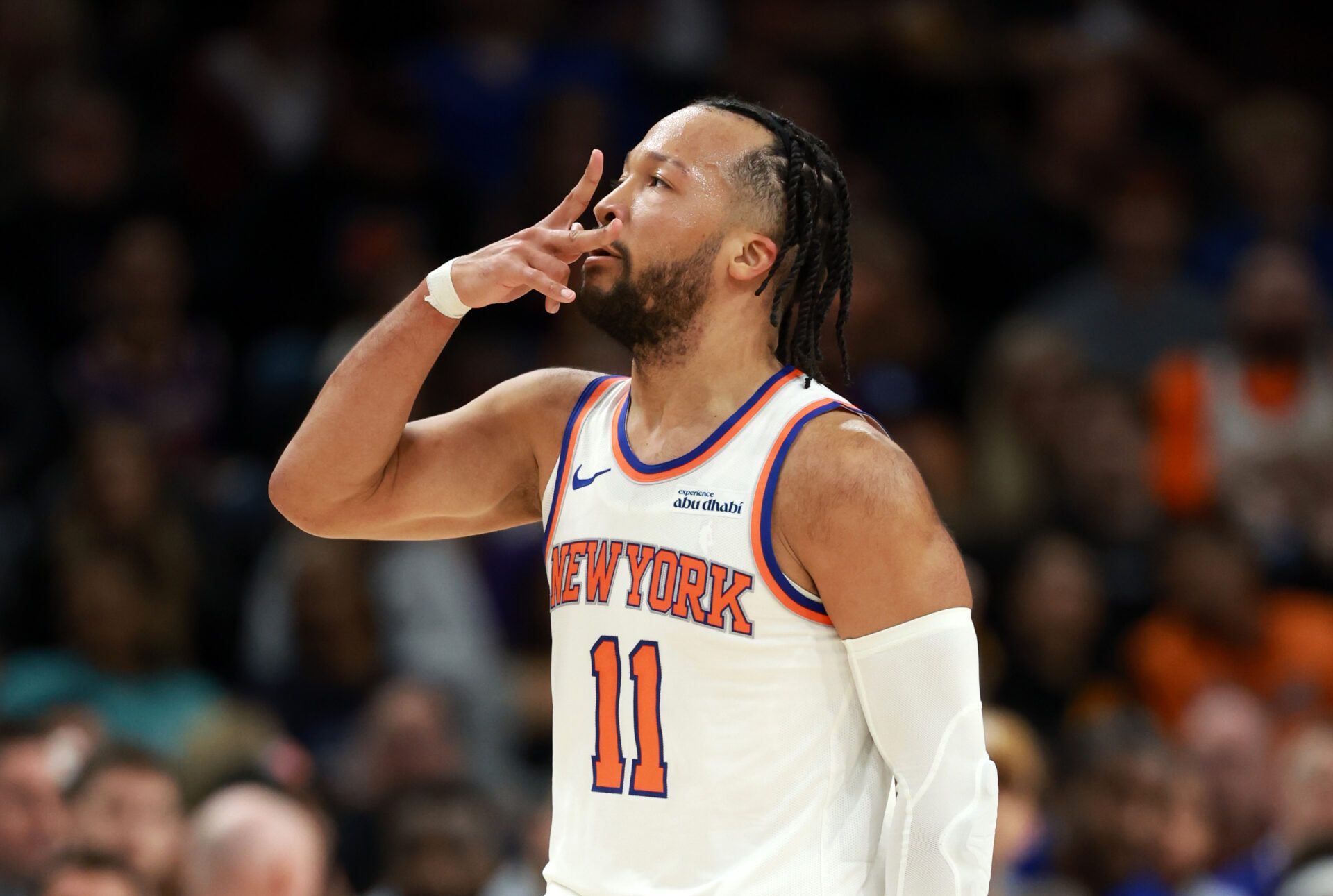 New York Knicks guard Jalen Brunson (11) celebrates a three point shot against the Phoenix Suns in the second half at Mortgage Matchup Center.