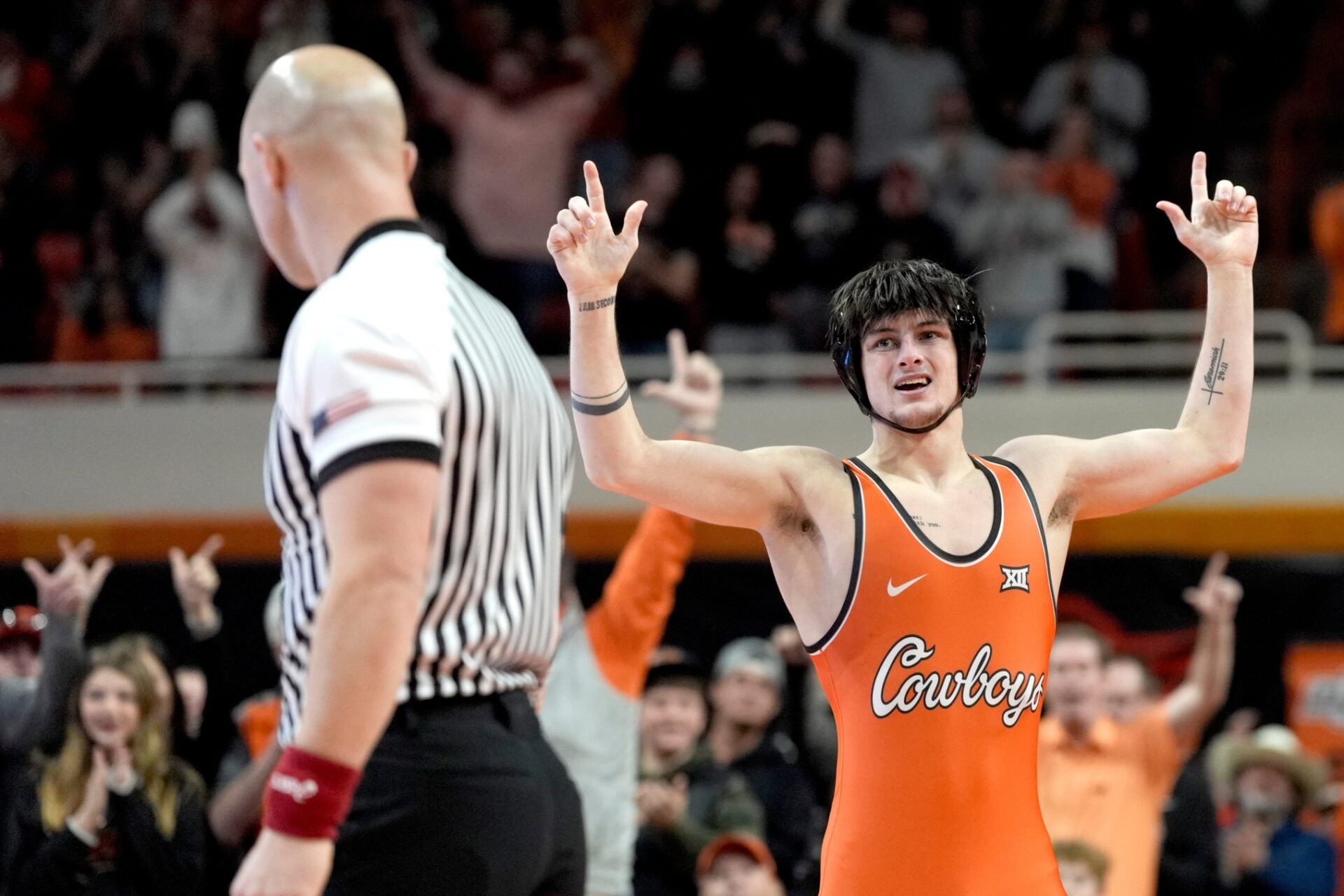 Oklahoma State's Jax Forrest celebrates after winning his match over Oklahoma's Carter Schmidt at 133 pounds during a Bedlam wrestling dual between the Oklahoma State Cowboys (OSU) and the University of Oklahoma Sooners (OU) at Gallagher-Iba in Stillwater, Okla., Sunday, Jan. 11, 2026.