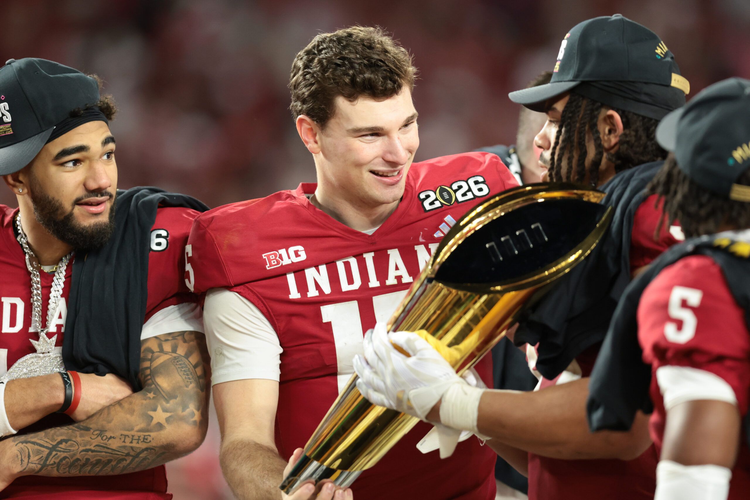 Indiana Hoosiers quarterback Fernando Mendoza (15) lifts the trophy after the College Football Playoff National Championship game against the Miami Hurricanes at Hard Rock Stadium.