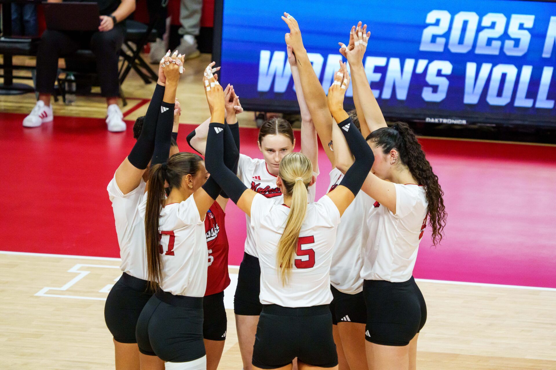 The Nebraska Cornhuskers huddle before the match against the Texas A&M Aggies at Bob Devaney Sports Center.