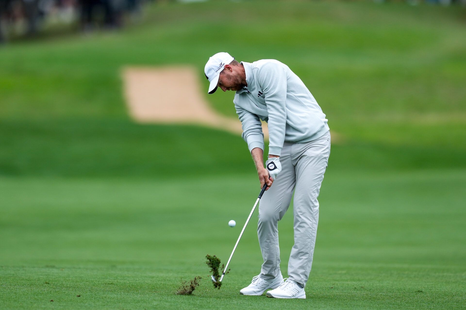 Daniel Berger hits a shot on the first hole during the third round of the Valero Texas Open golf tournament.