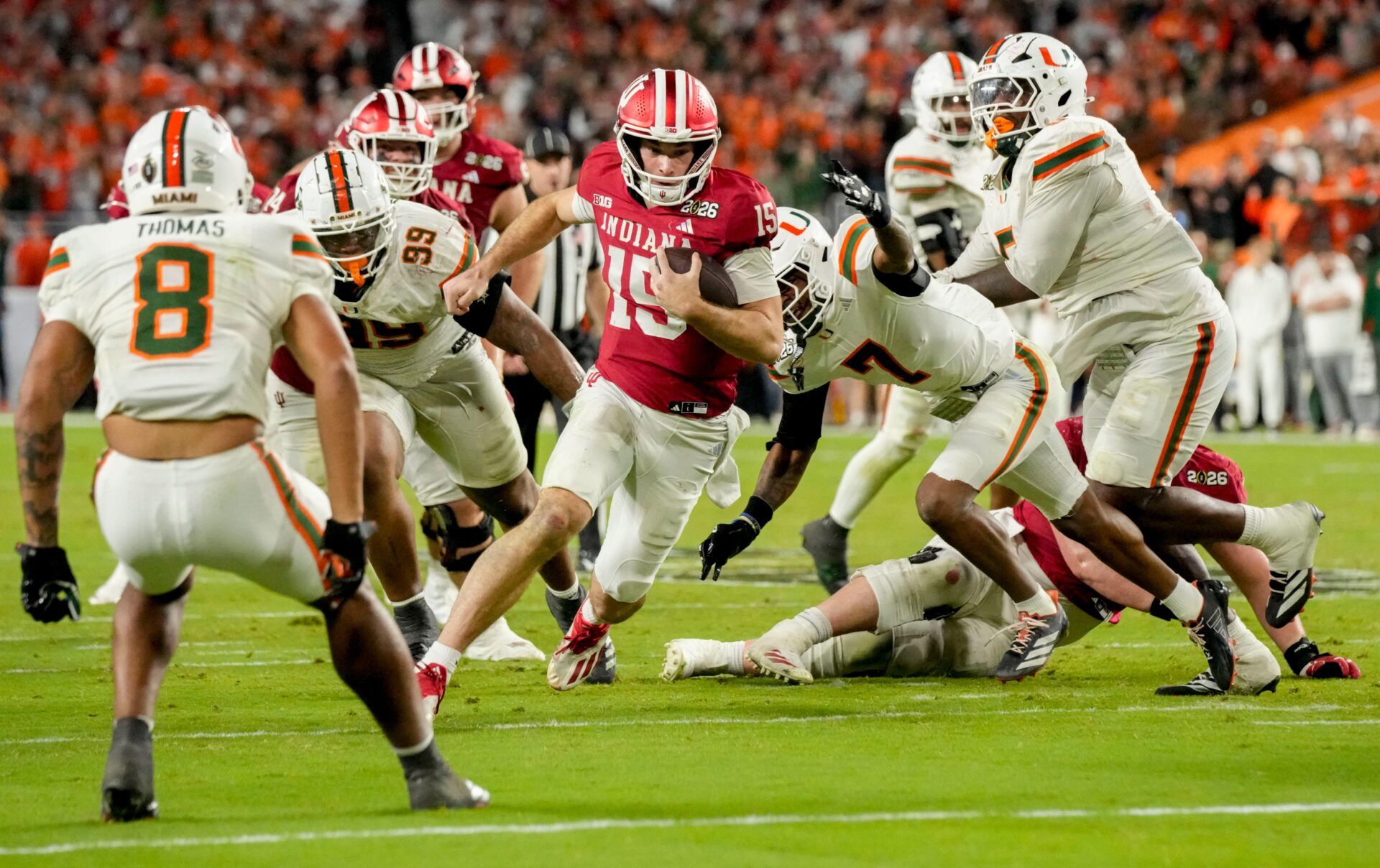 Indiana Hoosiers quarterback Fernando Mendoza (15) rushes into the end zone for a touchdown Monday, Jan. 19, 2026, during the College Football Playoff National Championship college football game against the Miami (FL) Hurricanes at Hard Rock Stadium in Miami Gardens.
