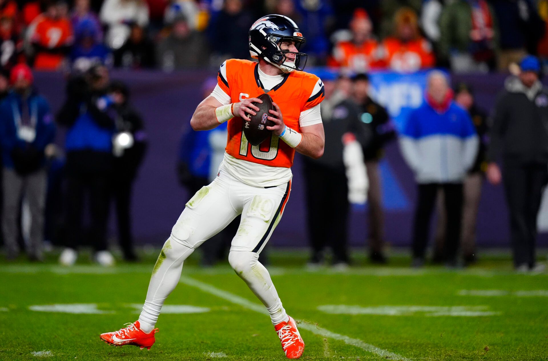 Denver Broncos quarterback Bo Nix (10) drops to throw during the fourth quarter of an AFC Divisional Round playoff game against the Buffalo Bills at Empower Field at Mile High.
