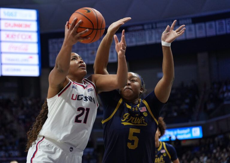 UConn Huskies forward Sarah Strong (21) drive to the basket against Notre Dame Fighting Irish forward Malaya Cowles (5) in the first half at Harry A. Gampel Pavilion.