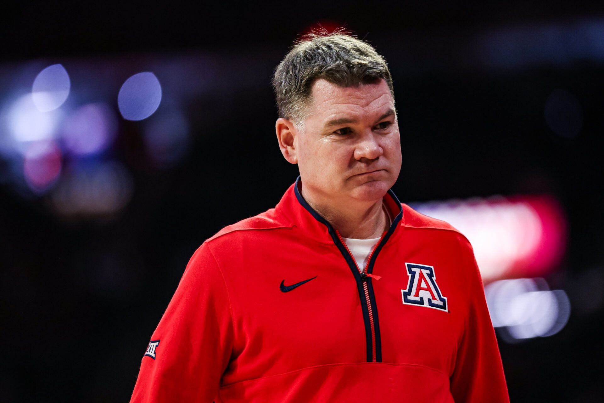Arizona Wildcats head coach Tommy Lloyd walks down the court during the first half of the game at McKale Memorial Center.