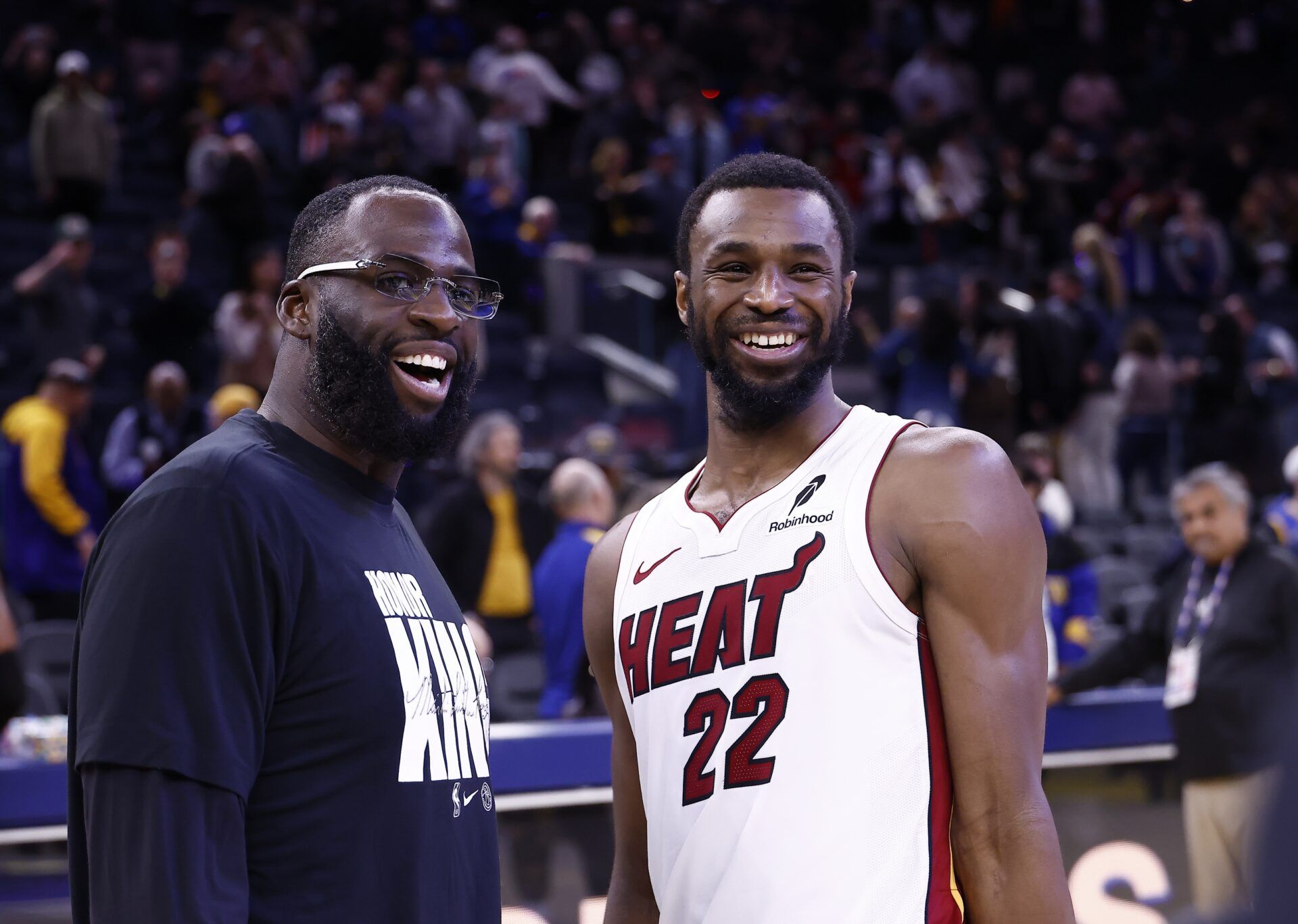 Golden State Warriors forward Draymond Green (23) smiles with Miami Heat forward Andrew Wiggins (22) after the game at Chase Center.