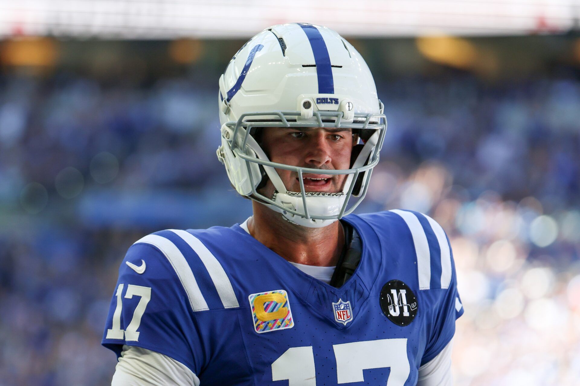 Indianapolis Colts quarterback Daniel Jones (17) reacts after scoring a touchdown against the Arizona Cardinals during the second quarter of the game at Lucas Oil Stadium.