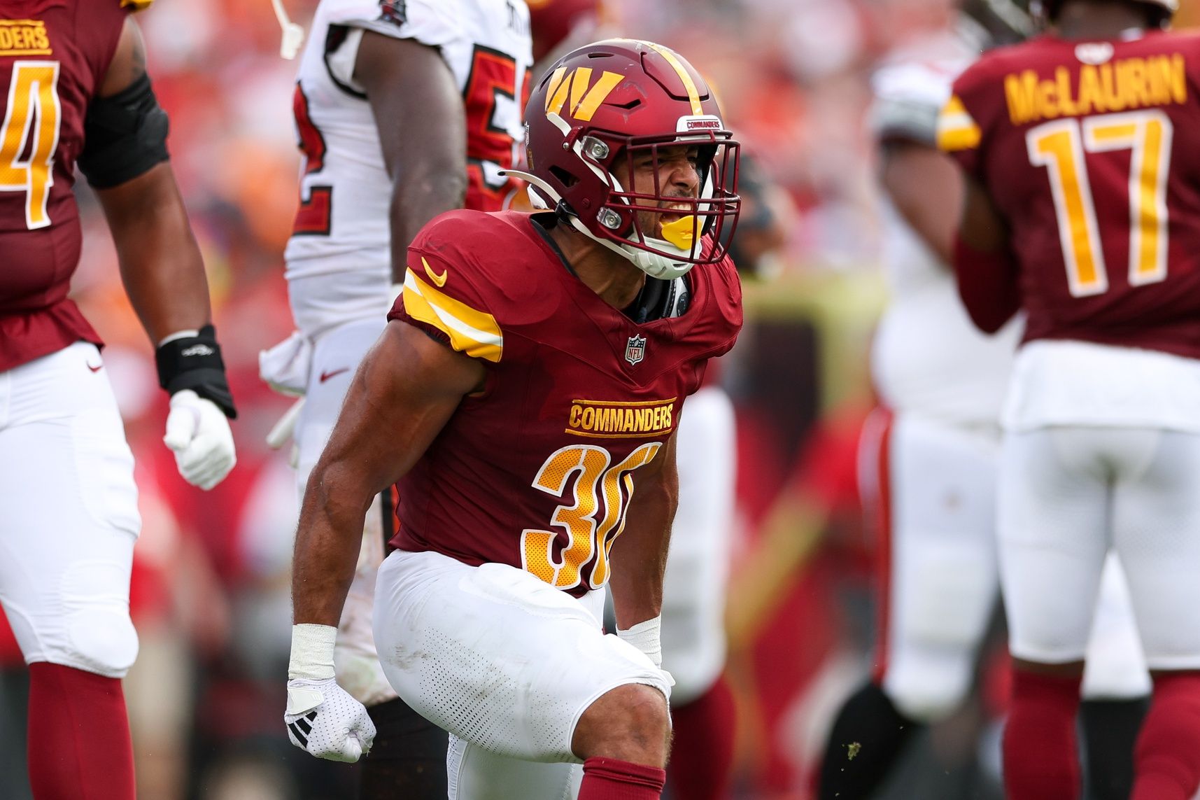 Washington Commanders running back Austin Ekeler (30) reacts after a run against the Tampa Bay Buccaneers in the second quarter at Raymond James Stadium.
