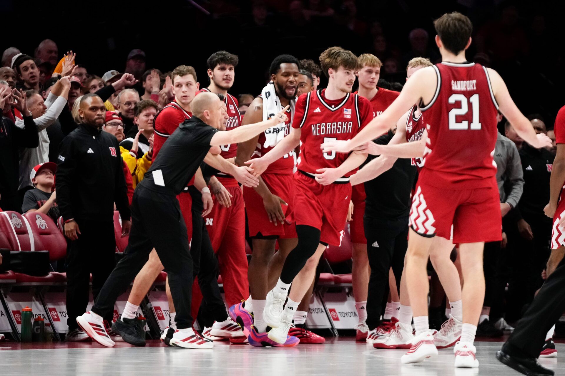 The Nebraska Cornhuskers bench reacts to a shot by forward Braden Frager (5) during the second half of the NCAA men's basketball game against the Ohio State Buckeyes at the Schottenstein Center in Columbus on Jan. 5, 2026. Ohio State lost 72-69.