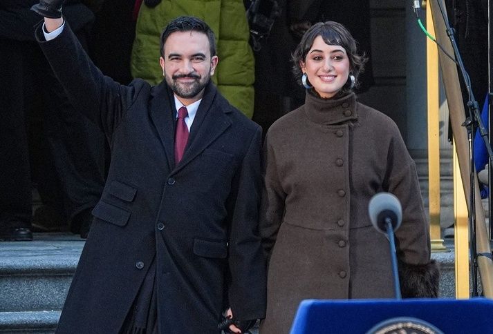 New York City Mayor Zohran Mamdani and his wife Rama Diwali walk out of city hall at the start of his public inauguration on Jan. 1, 2026.