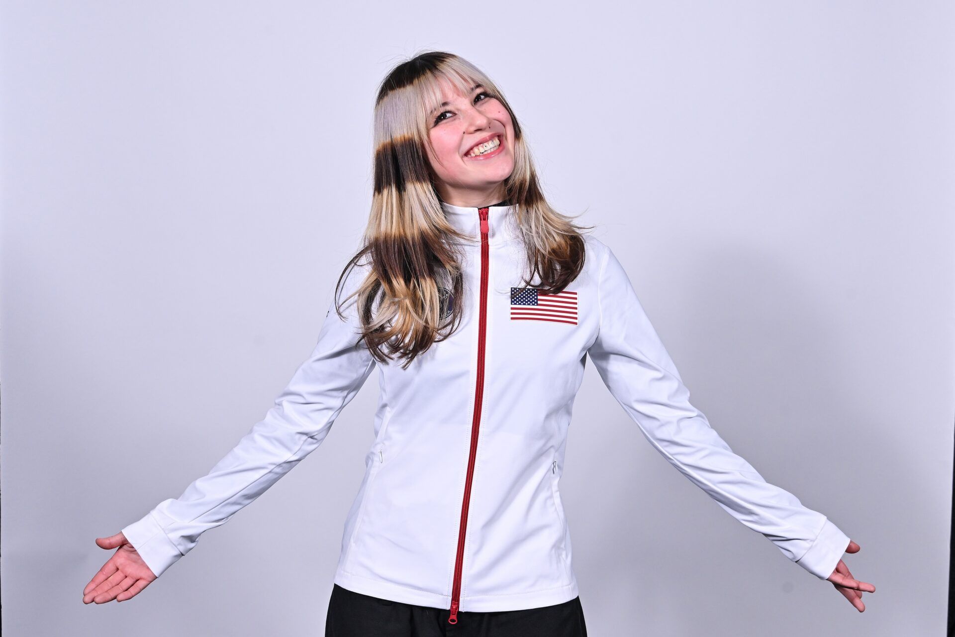 Alysa Liu poses for a photo following the 2026 Milan Olympics figure skating team announcement show at Enterprise Center.