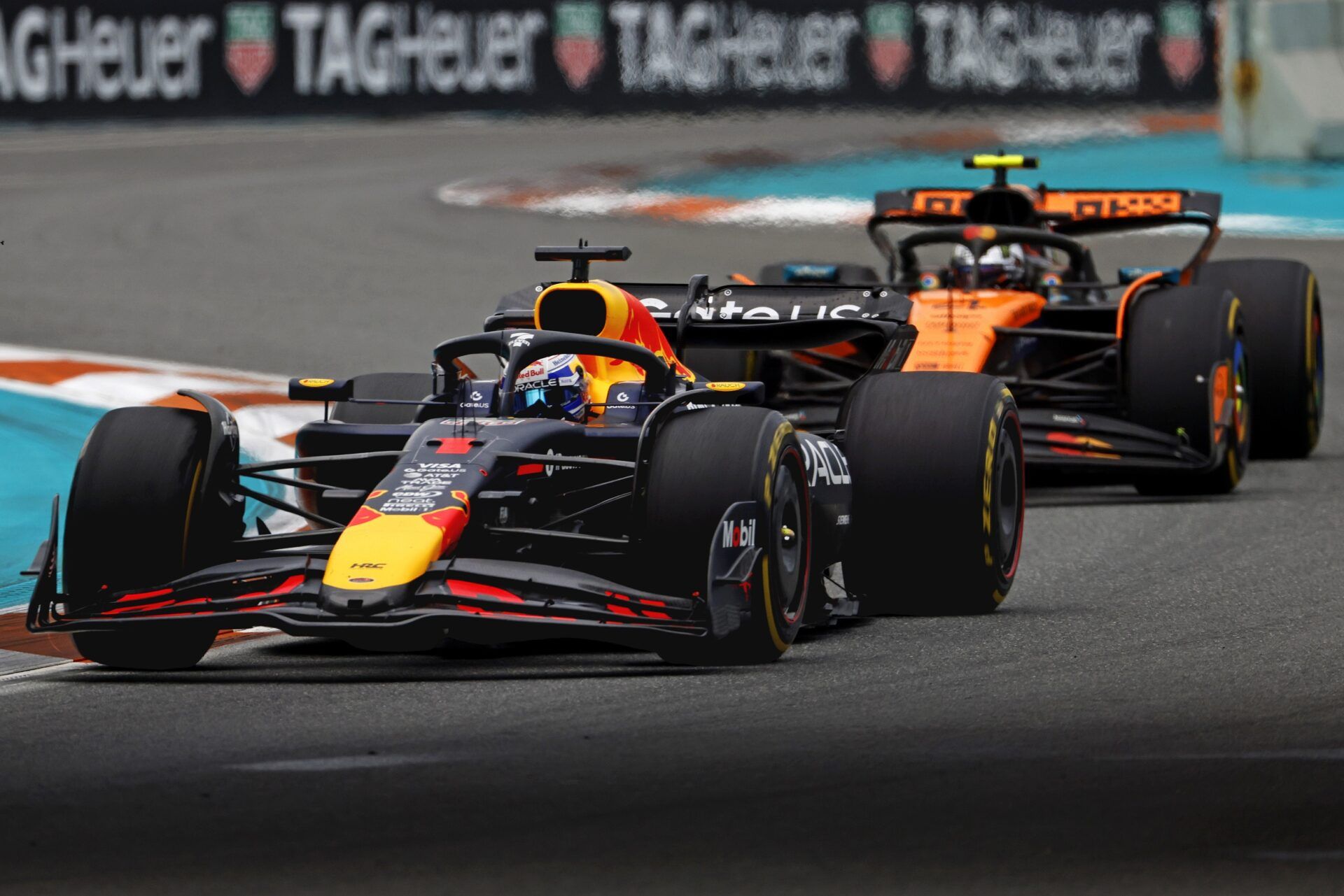Red Bull driver Max Verstappen (1) leads McLaren driver Lando Norris (4) during the F1 Miami Grand Prix at Miami International Autodrome.