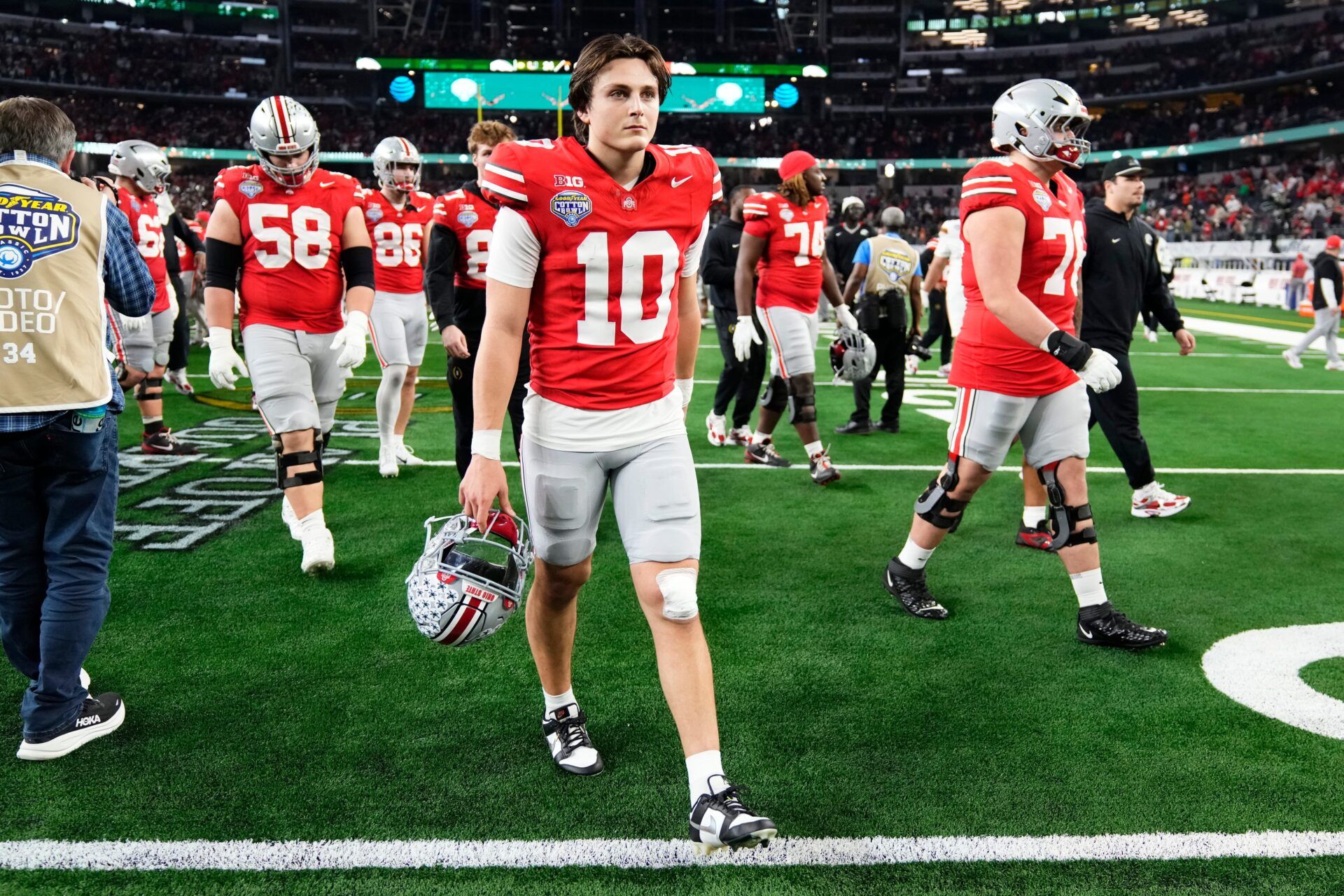 Ohio State Buckeyes quarterback Julian Sayin (10) leaves the field following the Cotton Bowl at AT&T Stadium in Arlington, Texas for the College Football Playoff quarterfinal game against the Miami Hurricanes on Dec. 31, 2025. Ohio State lost 24-14.