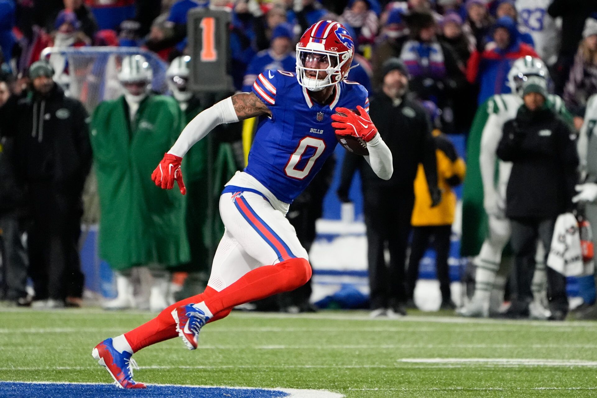 Buffalo Bills wide receiver Keon Coleman (0) carries the ball against the New York Jets during the third quarter at Highmark Stadium.