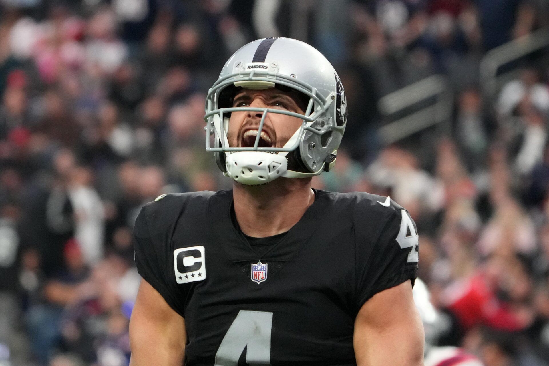 Las Vegas Raiders quarterback Derek Carr (4) celebrates after a touchdown against the New England Patriots in the first half at Allegiant Stadium.