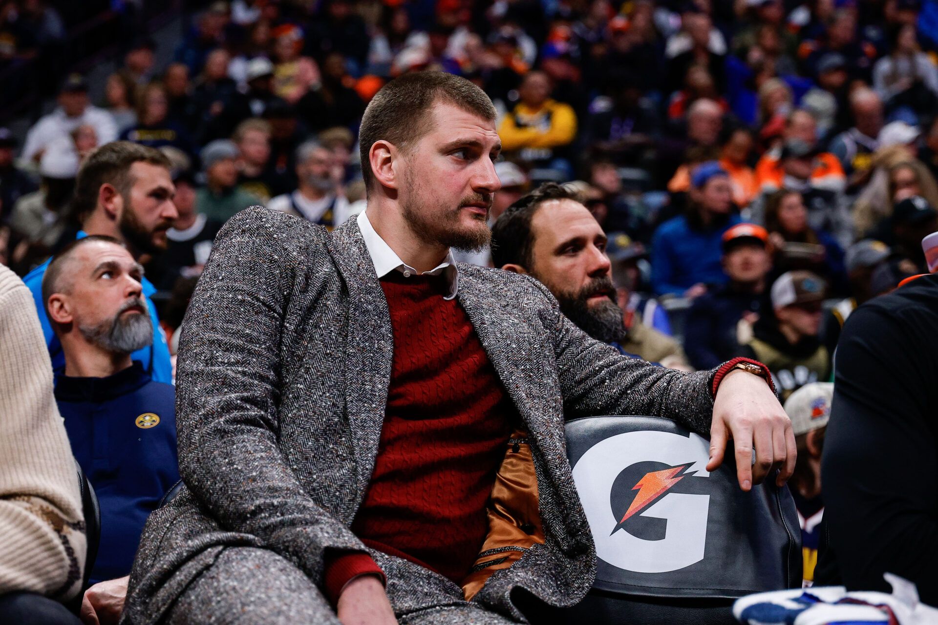 Denver Nuggets center Nikola Jokic (15) looks on from the bench in the third quarter against the Washington Wizards at Ball Arena.