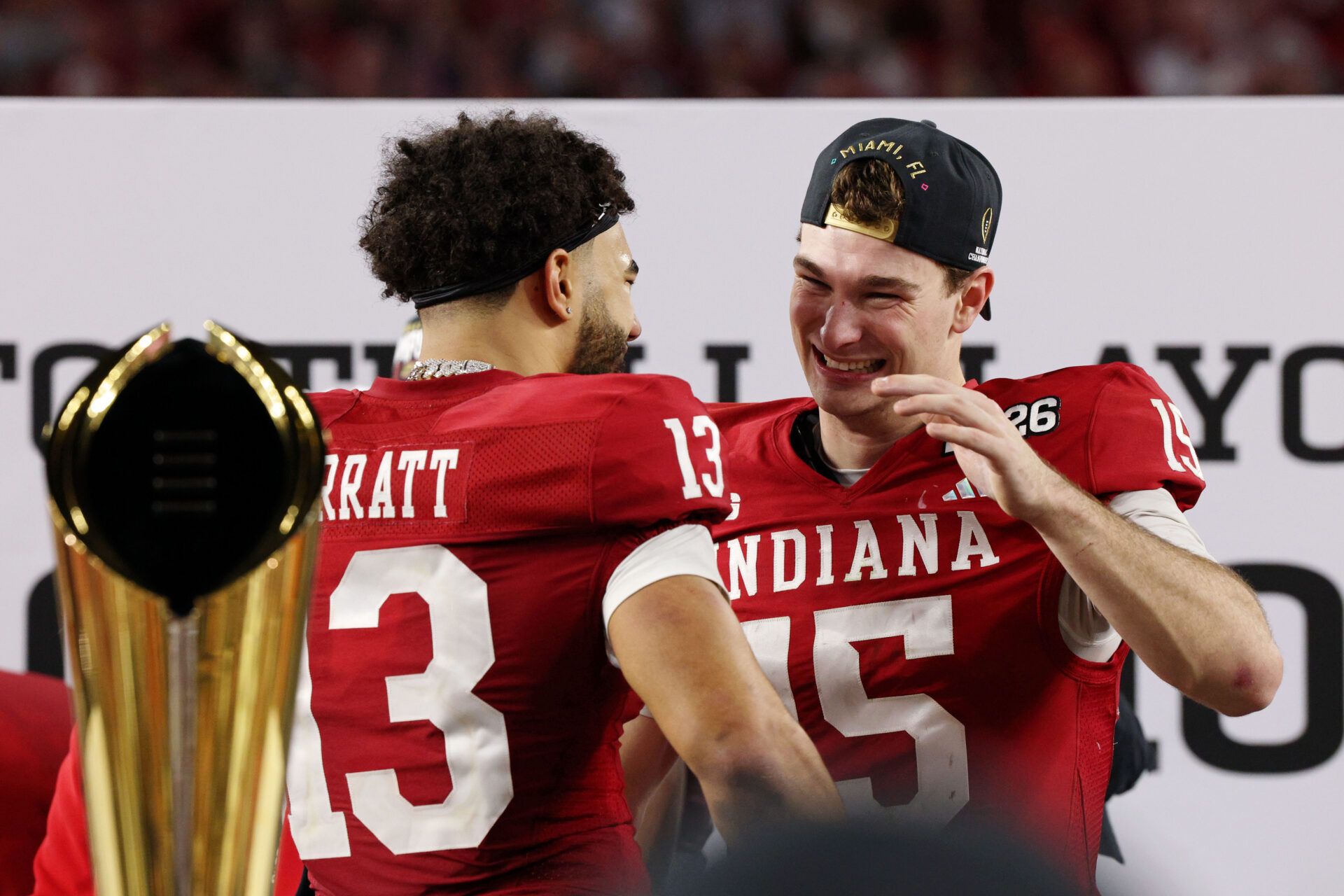 Indiana Hoosiers quarterback Fernando Mendoza (15) and Indiana Hoosiers wide receiver Elijah Sarratt (13) celebrate after winning the College Football Playoff National Championship game at Hard Rock Stadium.