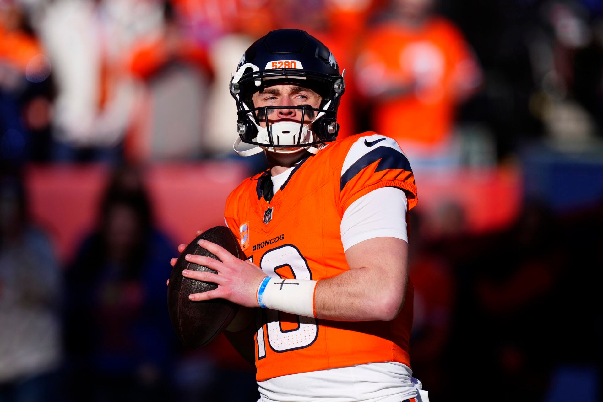 Denver Broncos quarterback Bo Nix (10) warms up before an AFC Divisional Round playoff game against the Buffalo Bills at Empower Field at Mile High.