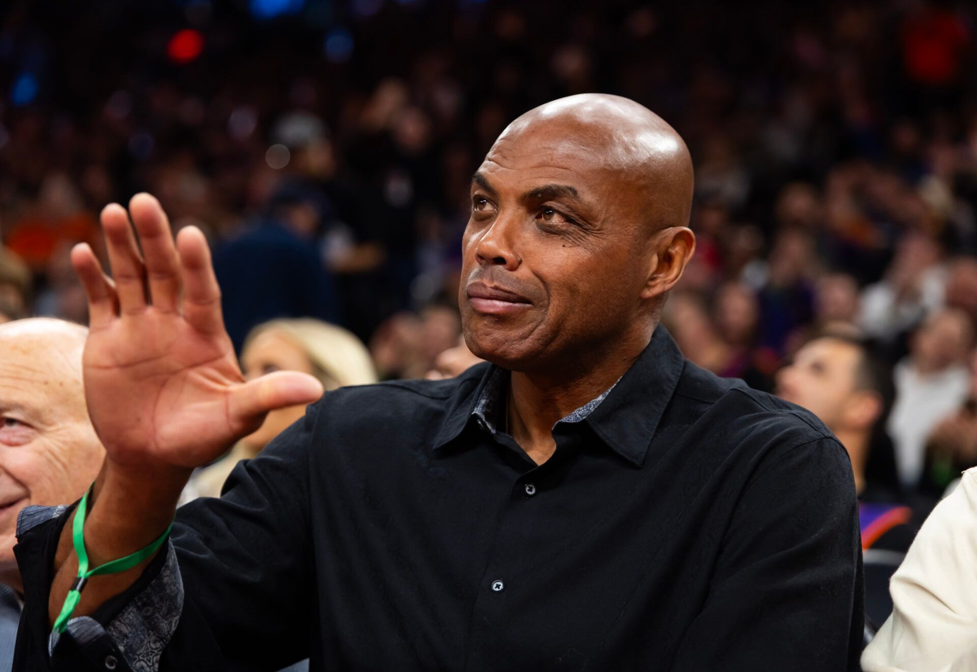 Phoenix Suns former player Charles Barkley sits courtside against the Minnesota Timberwolves during an NBA Cup game at Mortgage Matchup Center.