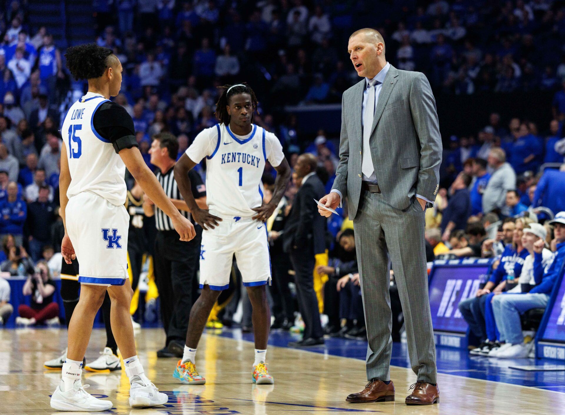 Kentucky Wildcats head coach Mark Pope talks with guards  Jaland Lowe (15) and Denzel Aberdeen (1) during the first half against the Missouri Tigers at Rupp Arena at Central Bank Center.