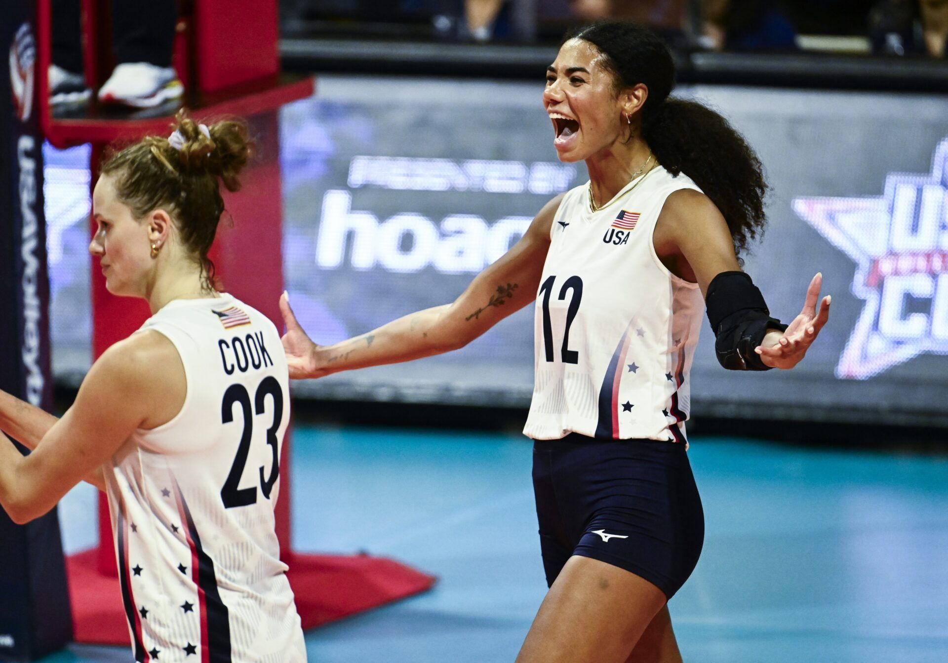 Jordan Thompson (12) and Kelsey Robinson Cook (23) celebrate scoring a point against the Netherlands during the USA Volleyball Cup at The Walter Pyramid. The USA defeated the Netherlands 3 -2 in a tuneup for the upcoming Paris Olympics.