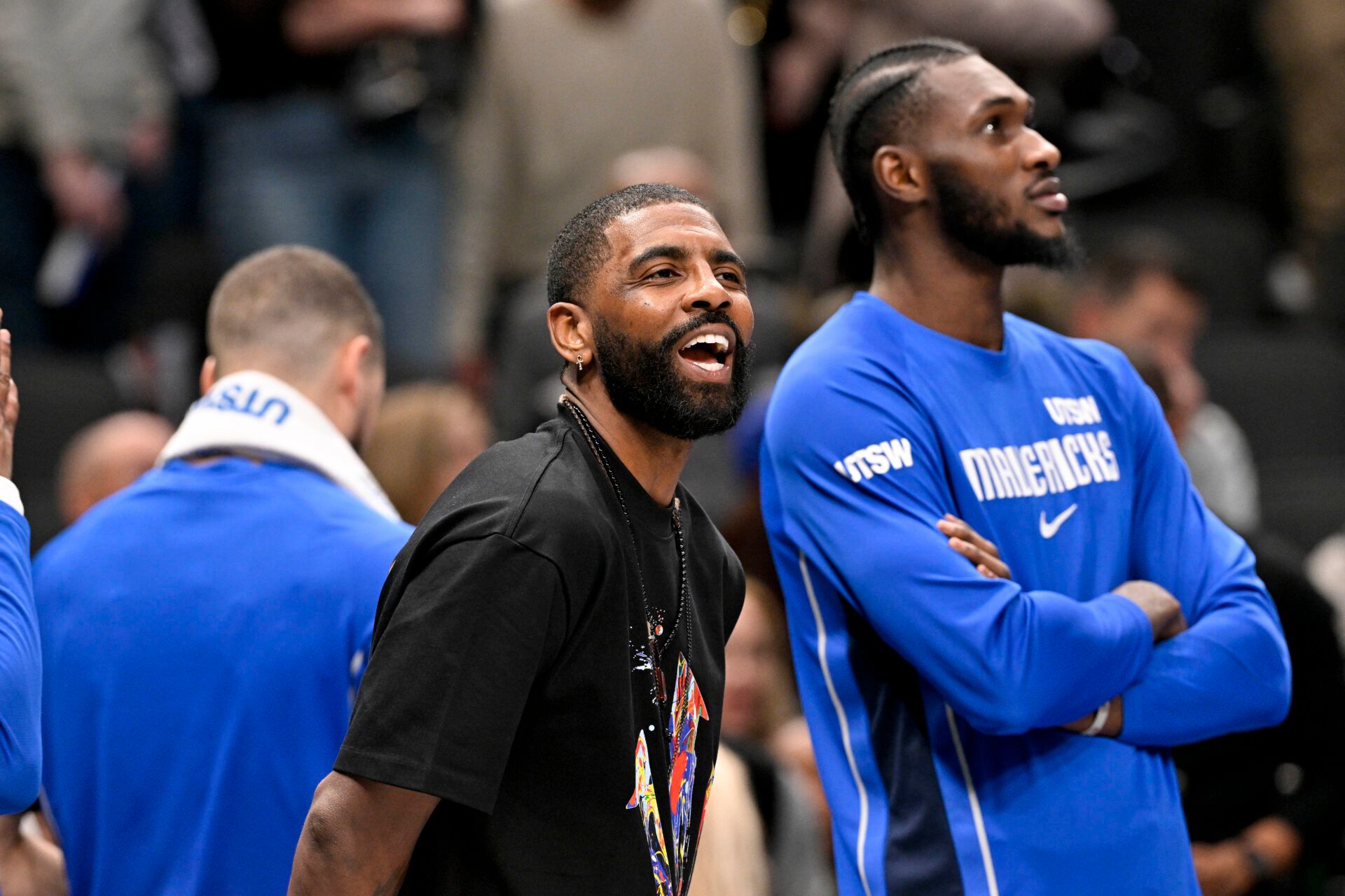 Dallas Mavericks guard Kyrie Irving (11) jokes with his teammates during the second half against the Brooklyn Nets at the American Airlines Center.