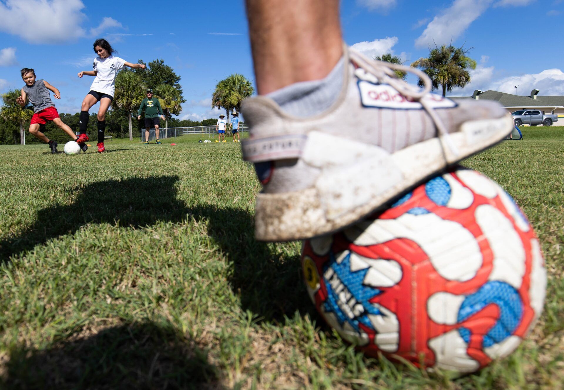 Zander Churchill, 9, left, battles for control of the ball from Alex Moles, 11 during soccer camp Wednesday. Forest High School Boys Soccer Coach Jason Wigginton and his players held a second soccer camp Thursday morning, July 13, 2022 at Forest High School. Camp counselors were teaching the young soccer players, ages six to 13, skills of the game which included skill of the day, juggling and passing along with one on one and three on three matches. The money raised from the camp goes to help the teams buy new uniforms and gear. The ratio was one counselor to two campers. [Doug Engle/Ocala Star Banner]2022

Oca Soccercamp