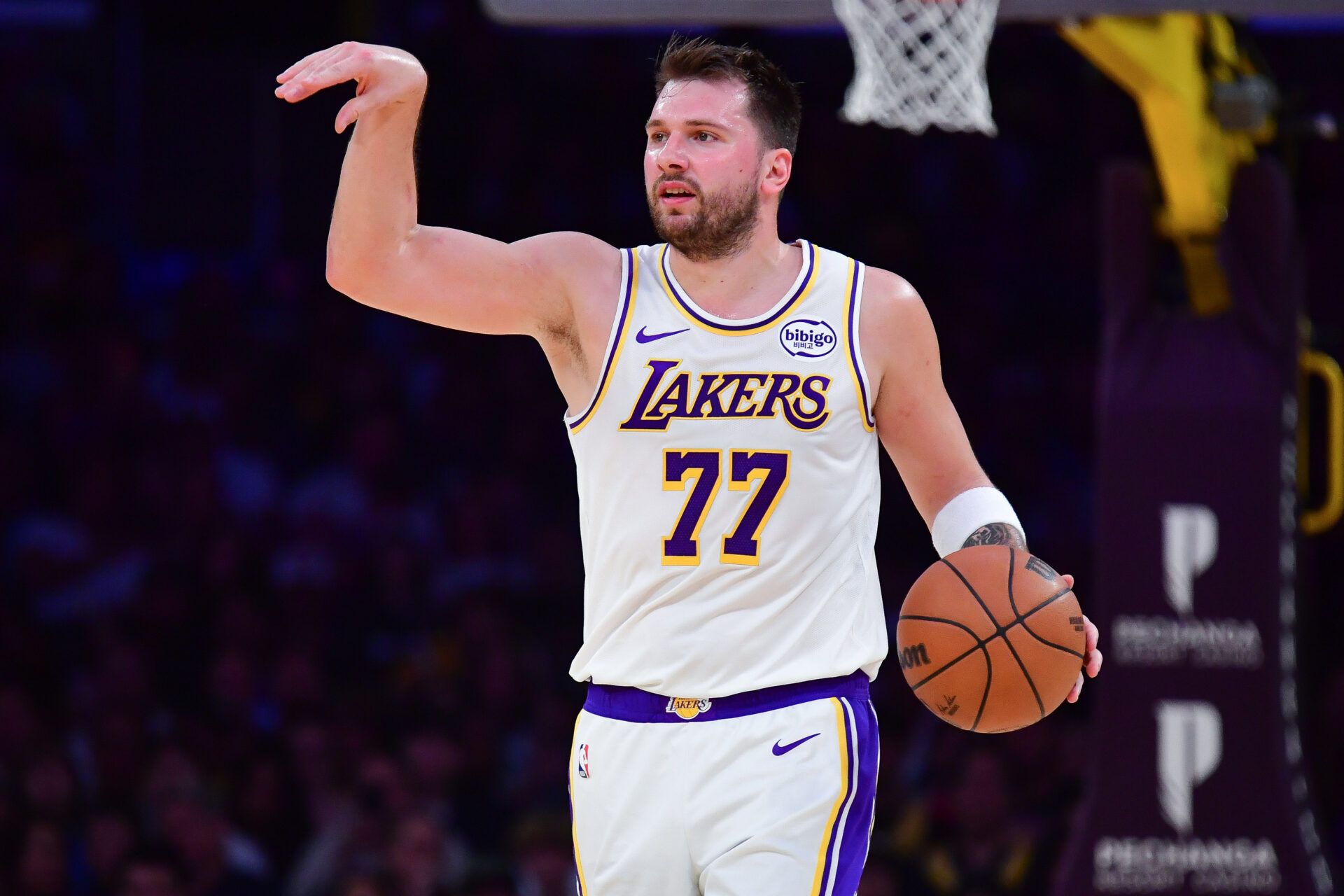 Los Angeles Lakers guard Luka Doncic (77) moves the ball down court against the Toronto Raptors during the first half at Crypto.com Arena.