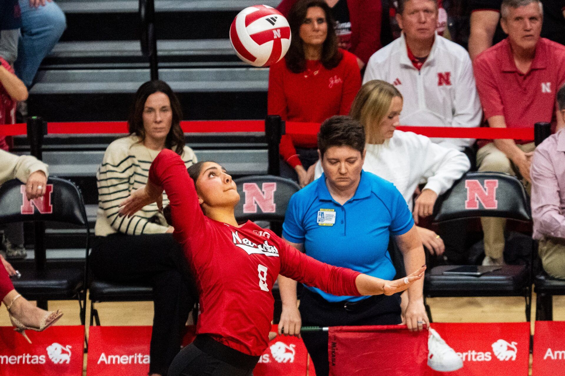 Nebraska Cornhuskers libero Lexi Rodriguez (8) serves against the Illinois Fighting Illini during the first set at Bob Devaney Sports Center.