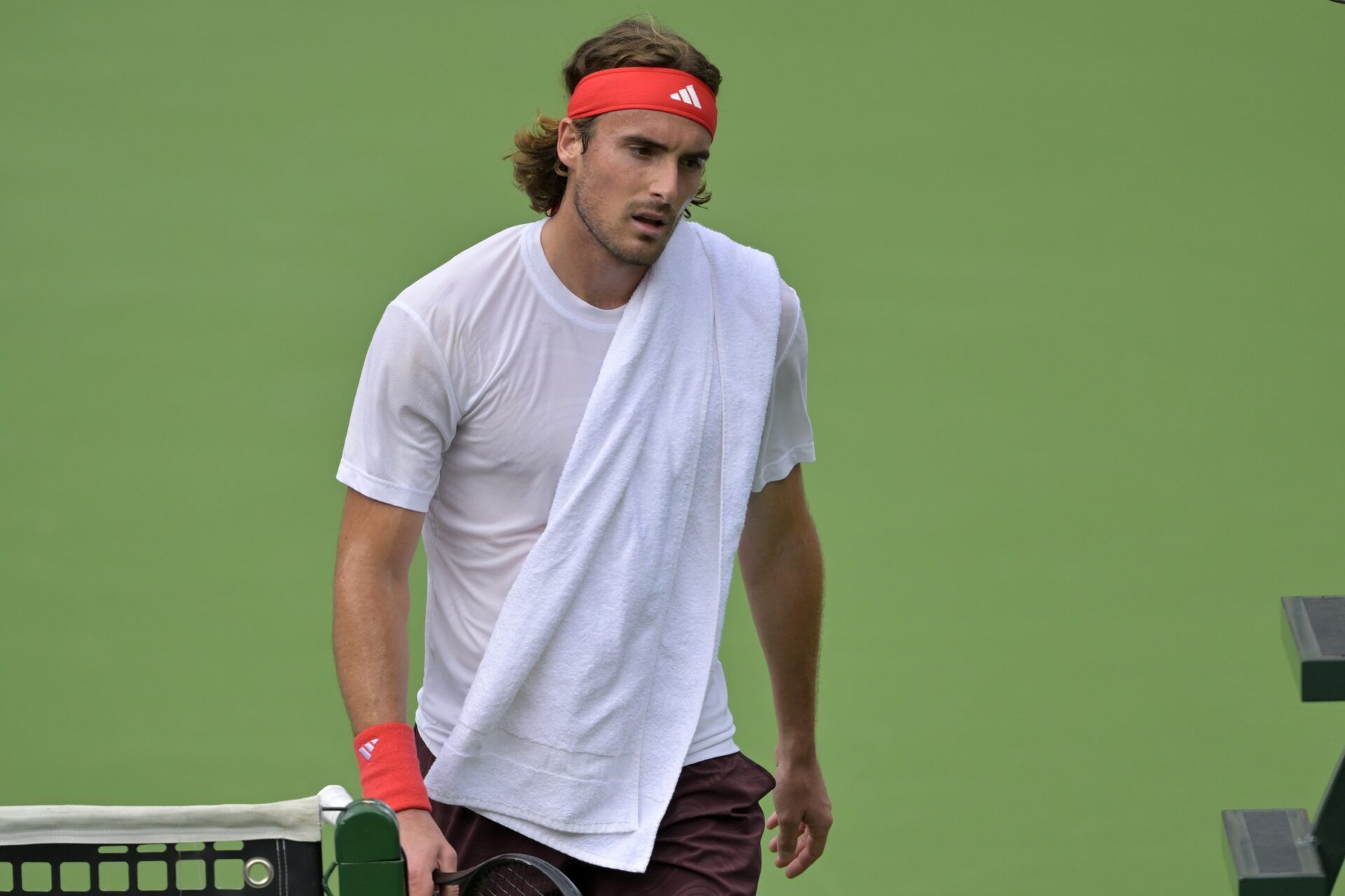 Stefanos Tsitsipas (GRE) walks to the bench during a change over during his fourth round match against Holger Rune (not pictured) at the BNP Paribas Open the at Indian Well Tennis Garden.