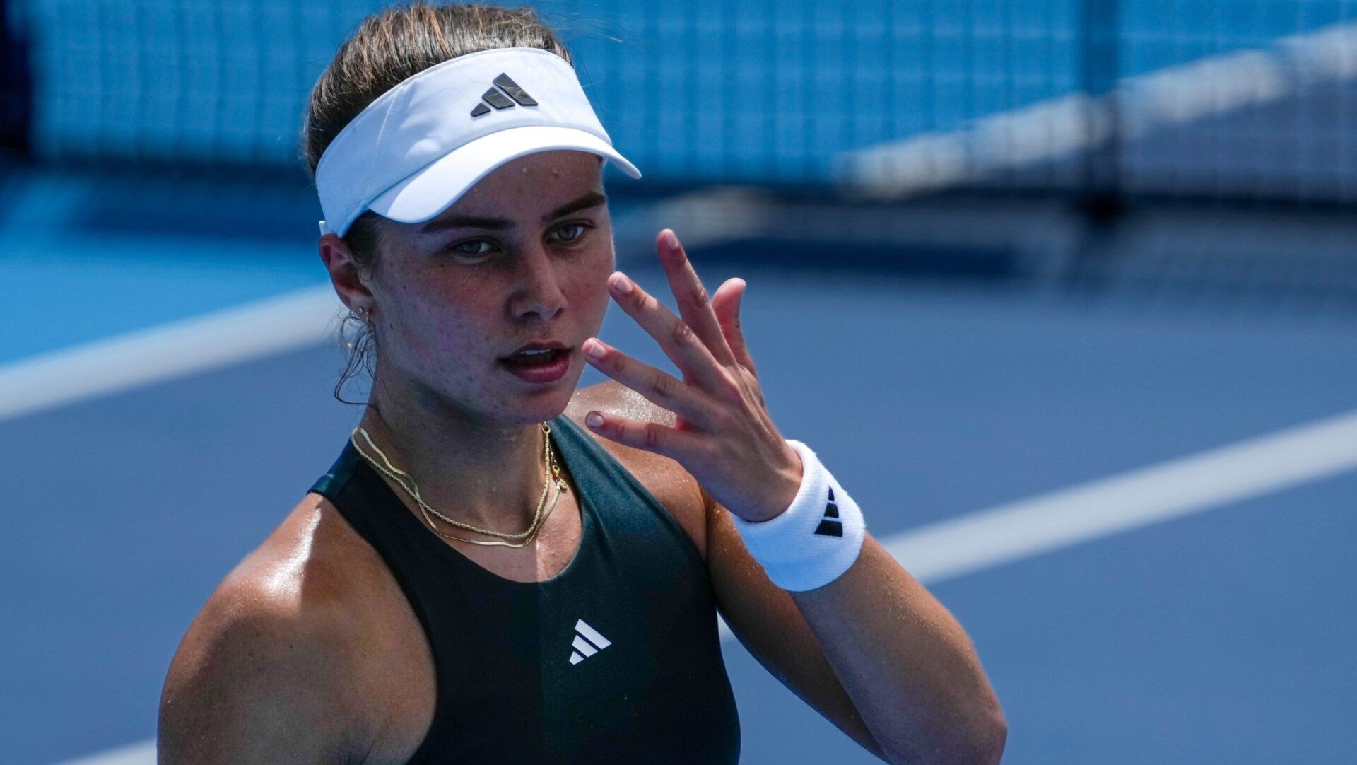 Iva Jovic asks for a towel in the Cincinnati Open third-round match with Barbora Krejcikova at the Lindner Family Tennis Center in Mason, Ohio, on Tuesday, Aug. 12, 2025. Krejcikova won, 6-4, 3-6, 6-2.