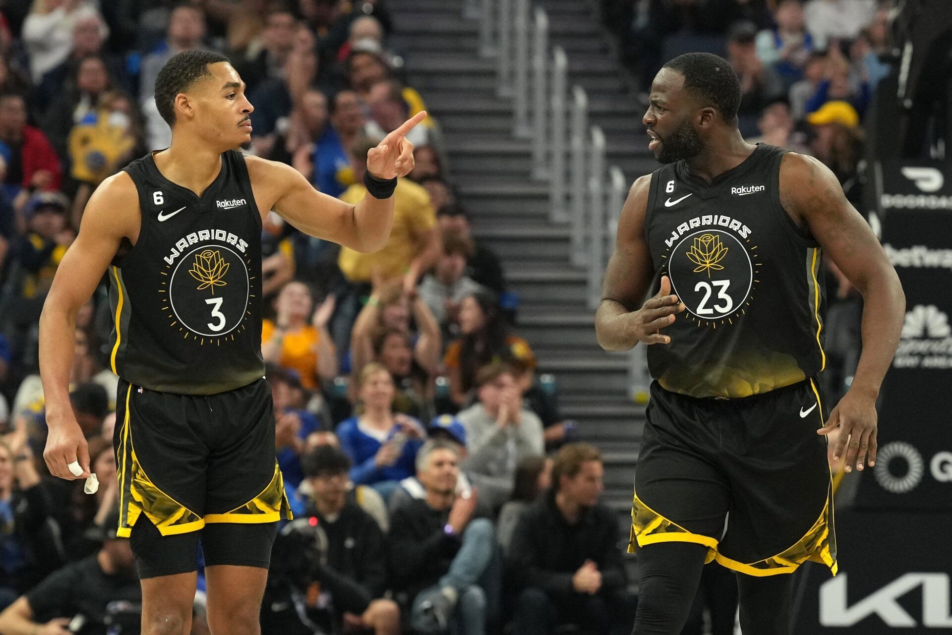 Golden State Warriors guard Jordan Poole (3) and forward Draymond Green (23) celebrate during the second quarter against the Utah Jazz at Chase Center.