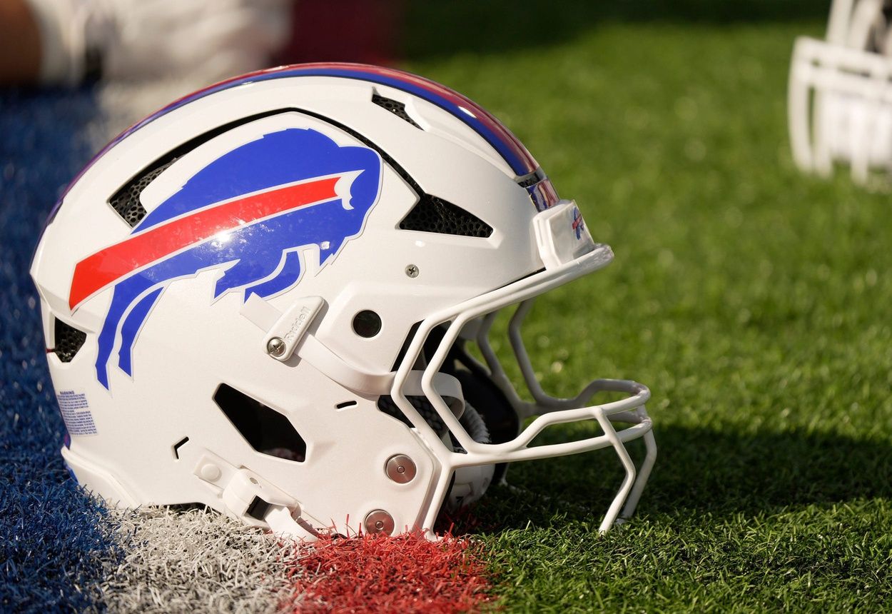 A Buffalo Bills helmet sits on a yard marker during stretching before the Return of the Blue & Red practice at Highmark Stadium in Orchard Park on Aug.1, 2025.