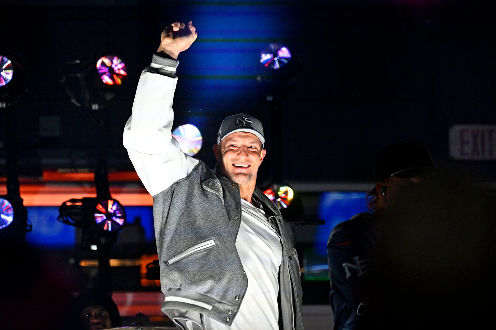 Rob Gronkowski smashes a New York Jets guitar during the halftime show at Gillette Stadium.
