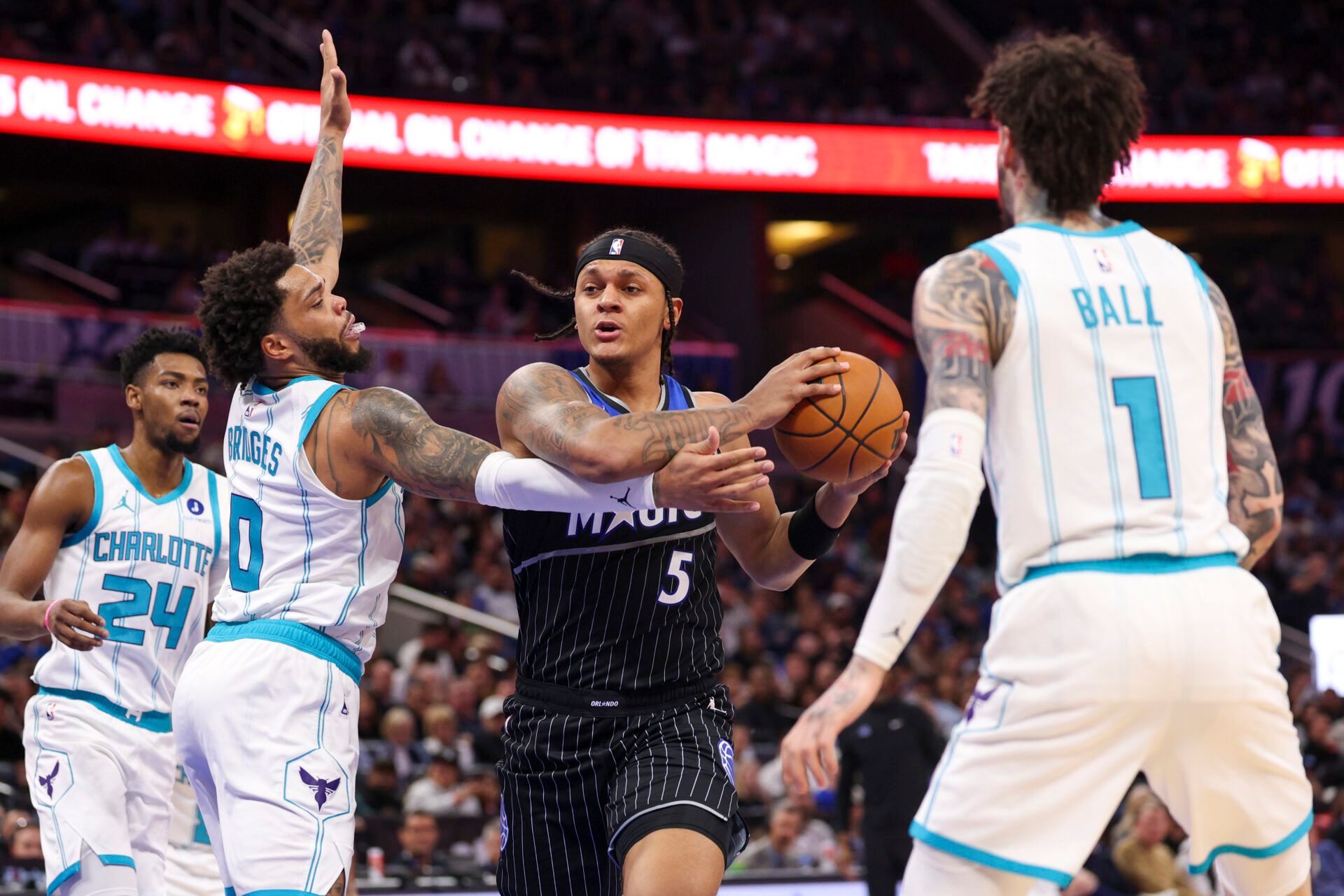 Orlando Magic forward Paolo Banchero (5) drives to the basket past Charlotte Hornets forward Miles Bridges (0) in the second quarter at Kia Center.