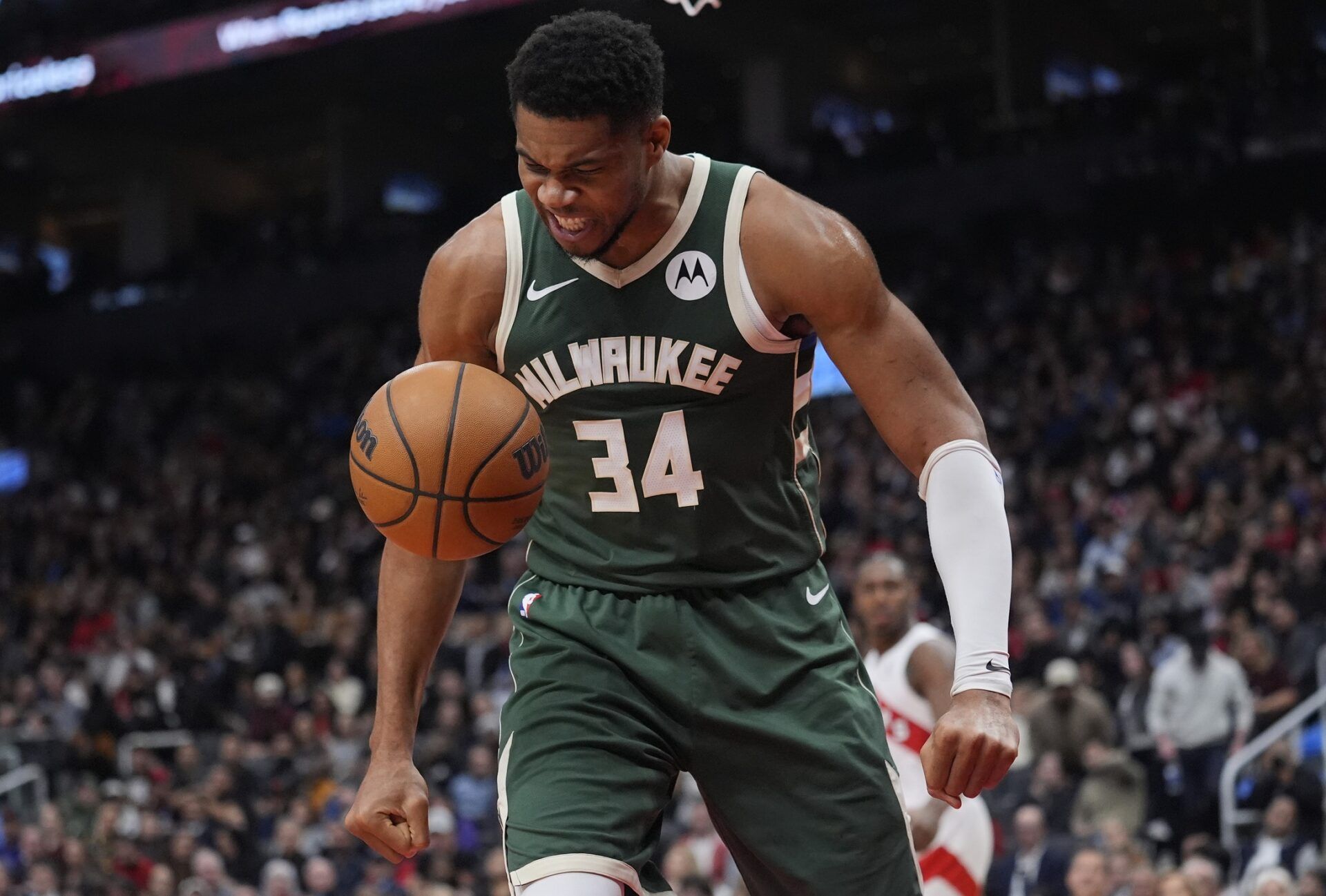 Milwaukee Bucks forward Giannis Antetokounmpo (34) reacts after making a basket against the Toronto Raptors during the first half at Scotiabank Arena.
