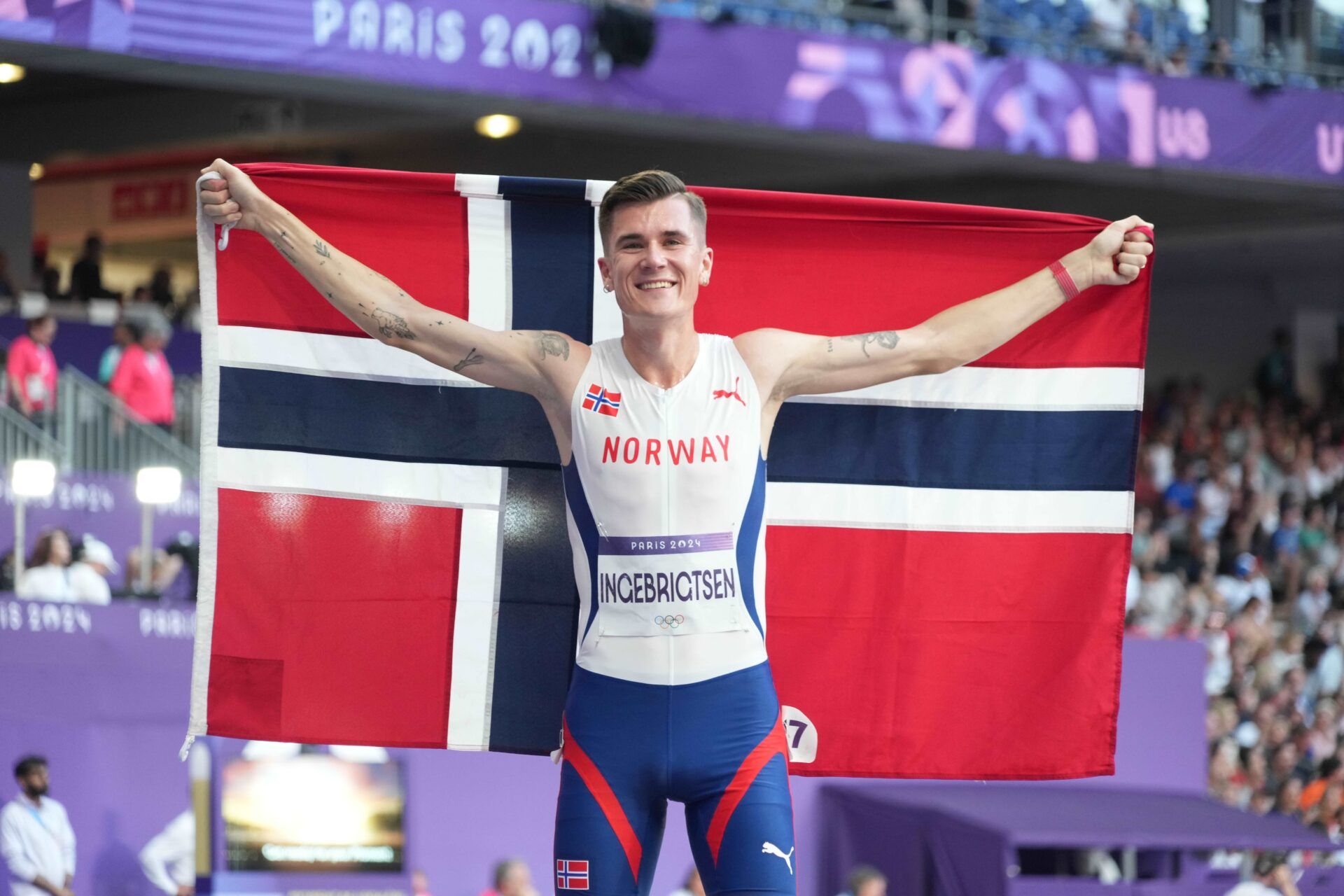Jakob Ingebrigtsen (NOR) celebrates after winning the men's 5000m final during the Paris 2024 Olympic Summer Games at Stade de France.